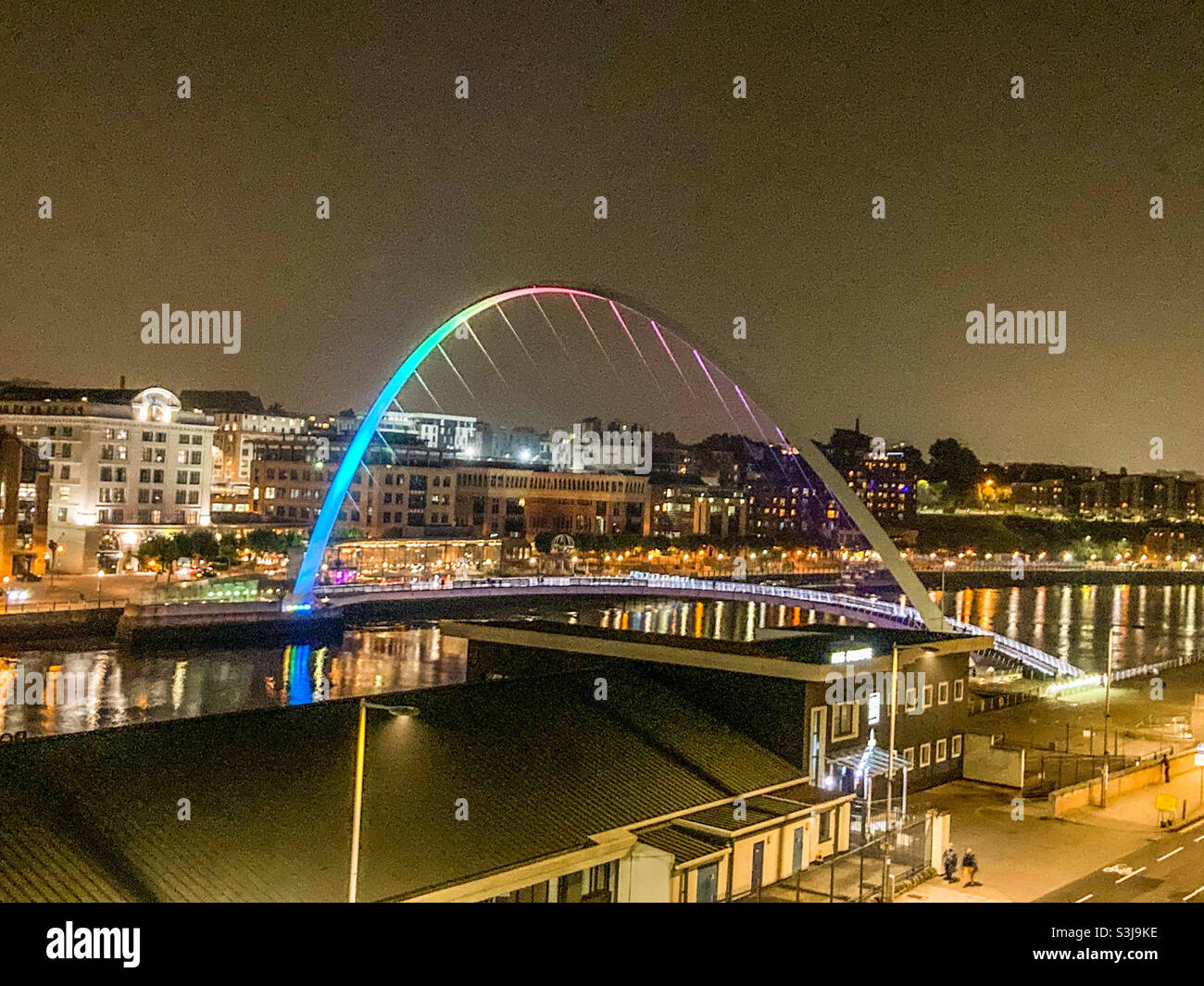 Newcastle Millennium Bridge and the river Tyne at night, as seen from The Sage building in Gateshead - Smartphone Captured Stock Image