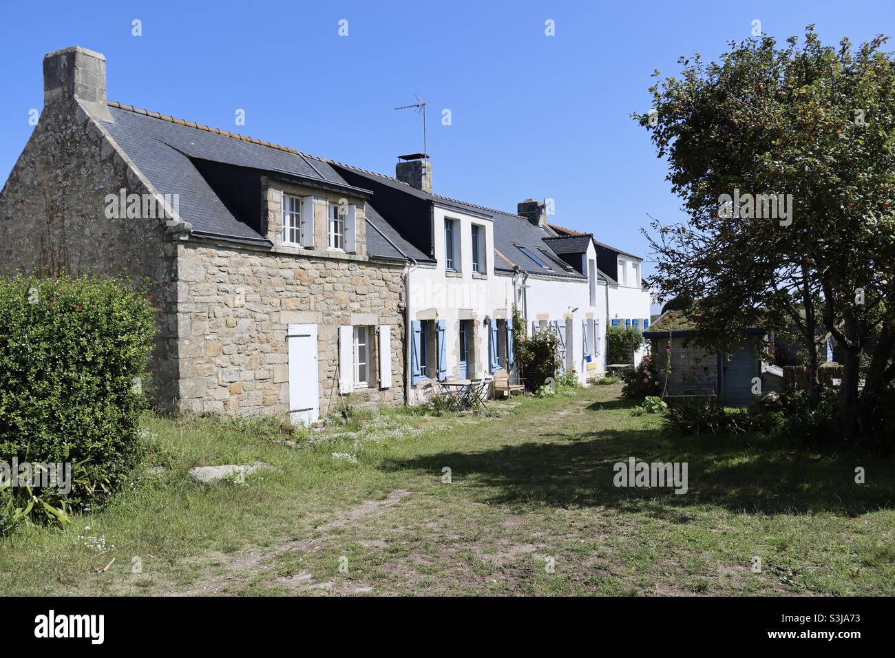 Typical architecture of houses in Brittany, at the island of Hoedic, department of Morbihan, France - Smartphone Captured Stock Image