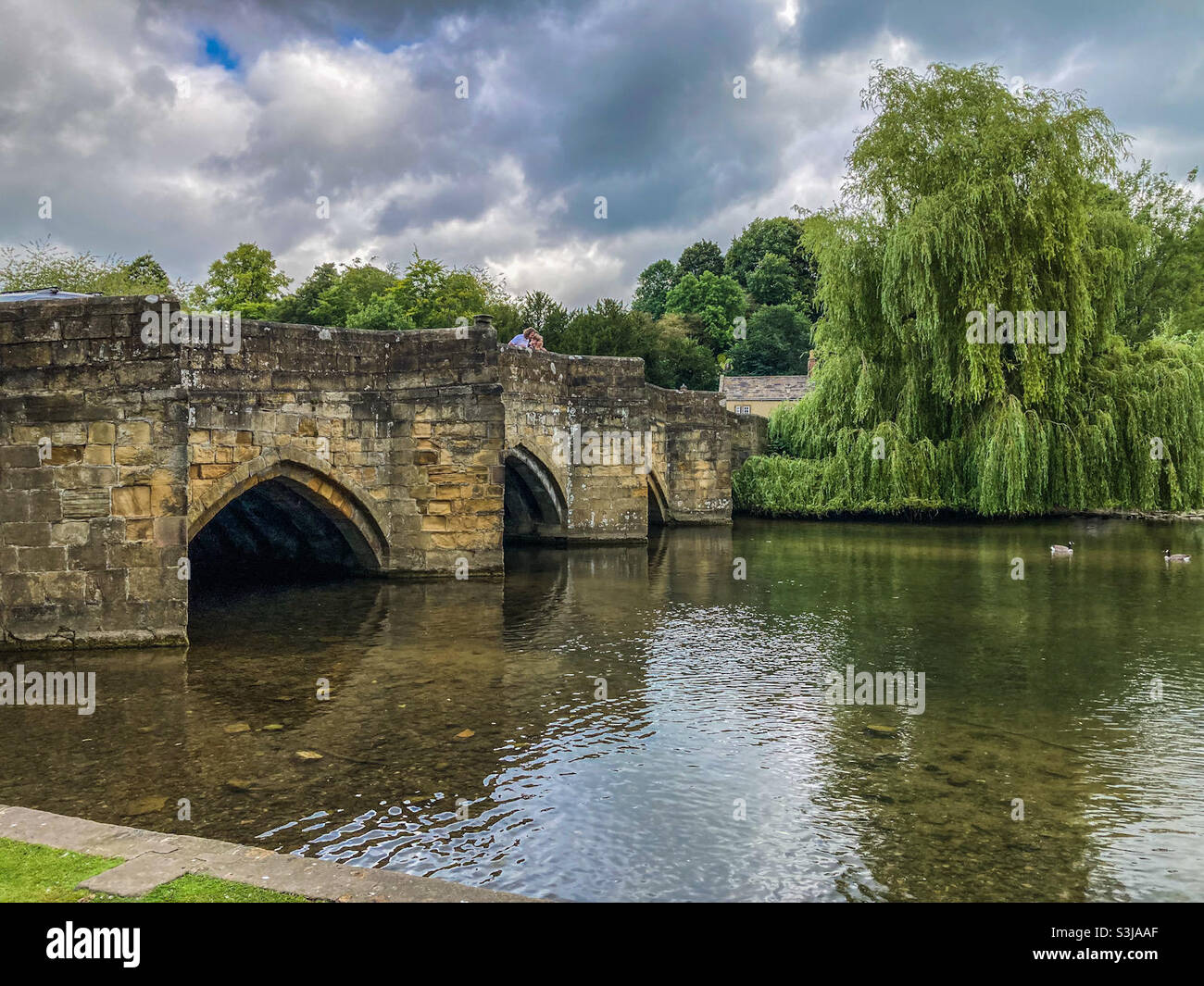 Bakewell Bridge over the River Wye in Bakewell, Derbyshire in the Peak District in September - Smartphone Captured Stock Image