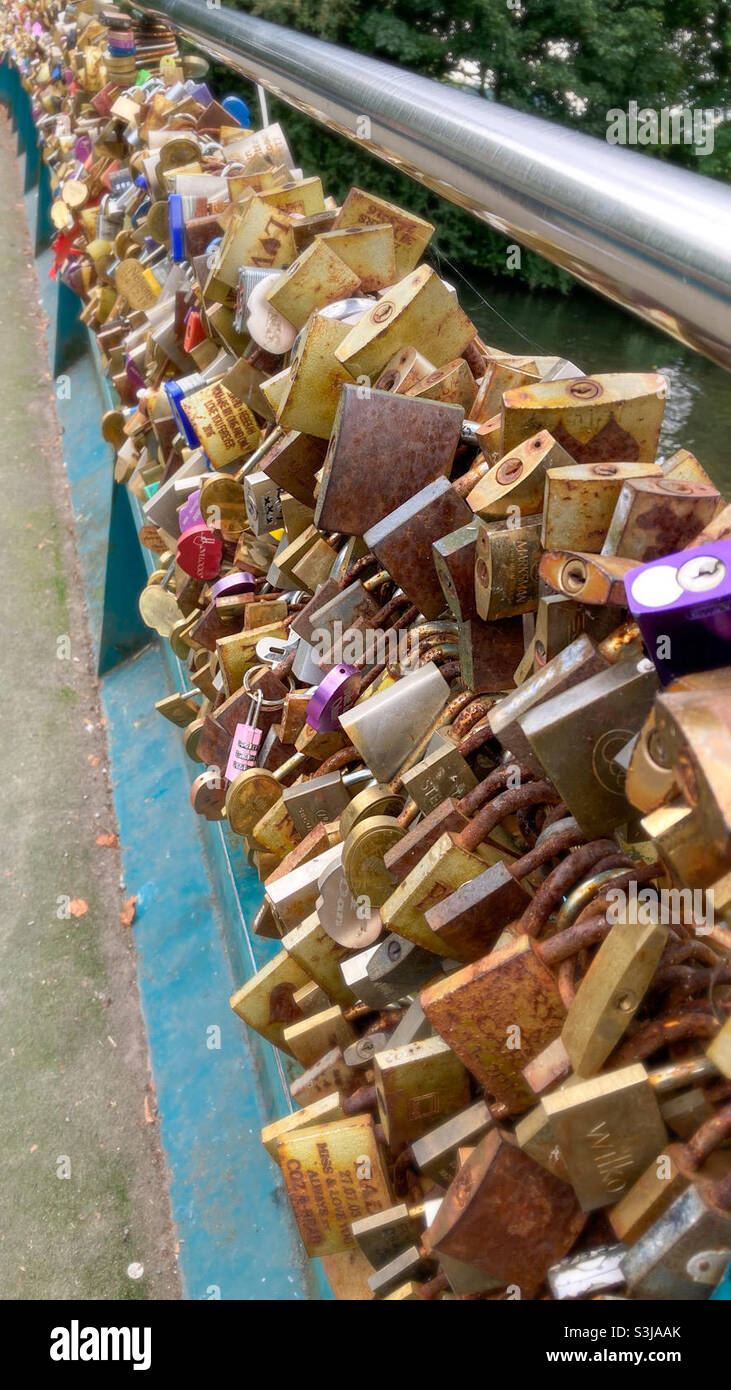 Love locks on Bakewell Bridge in Derbyshire - the locks engraved with messages and loved one’s initials started appearing on the bridge in 2012 - Smartphone Captured Stock Image