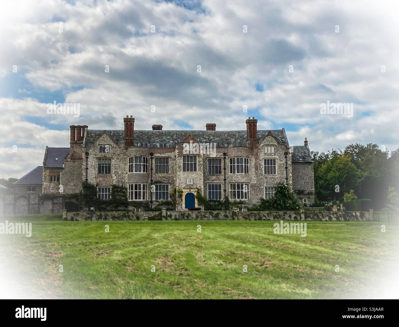 Glynde Place Elizabethan Manor House in Glynde, Lewes, East Sussex.  As seen from the private parkland.  Home to the current Viscount Hampden and his family. Stock Photo