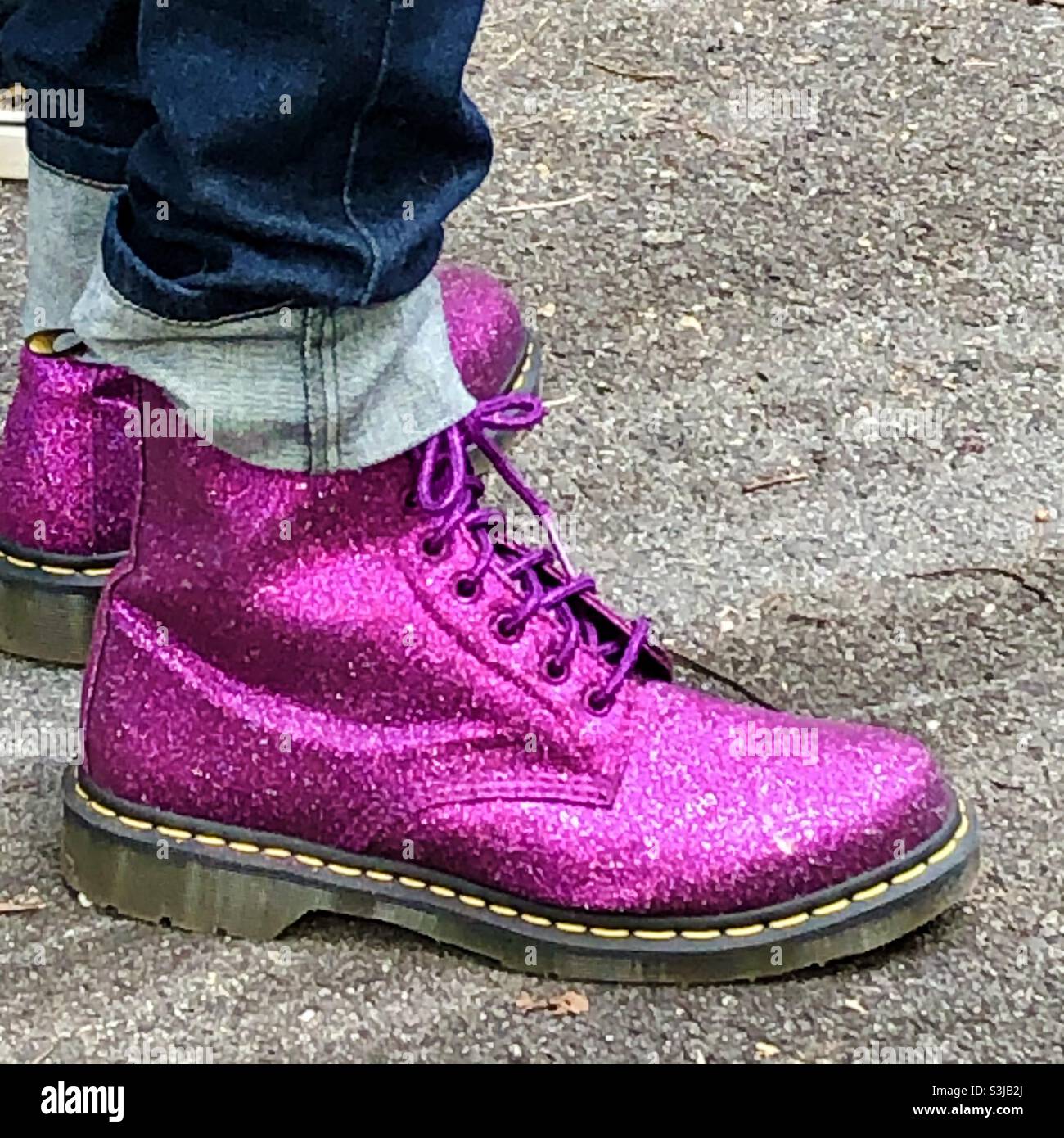 Purple Magenta Glitter Doc Martin boots worn by man Stock Photo - Alamy