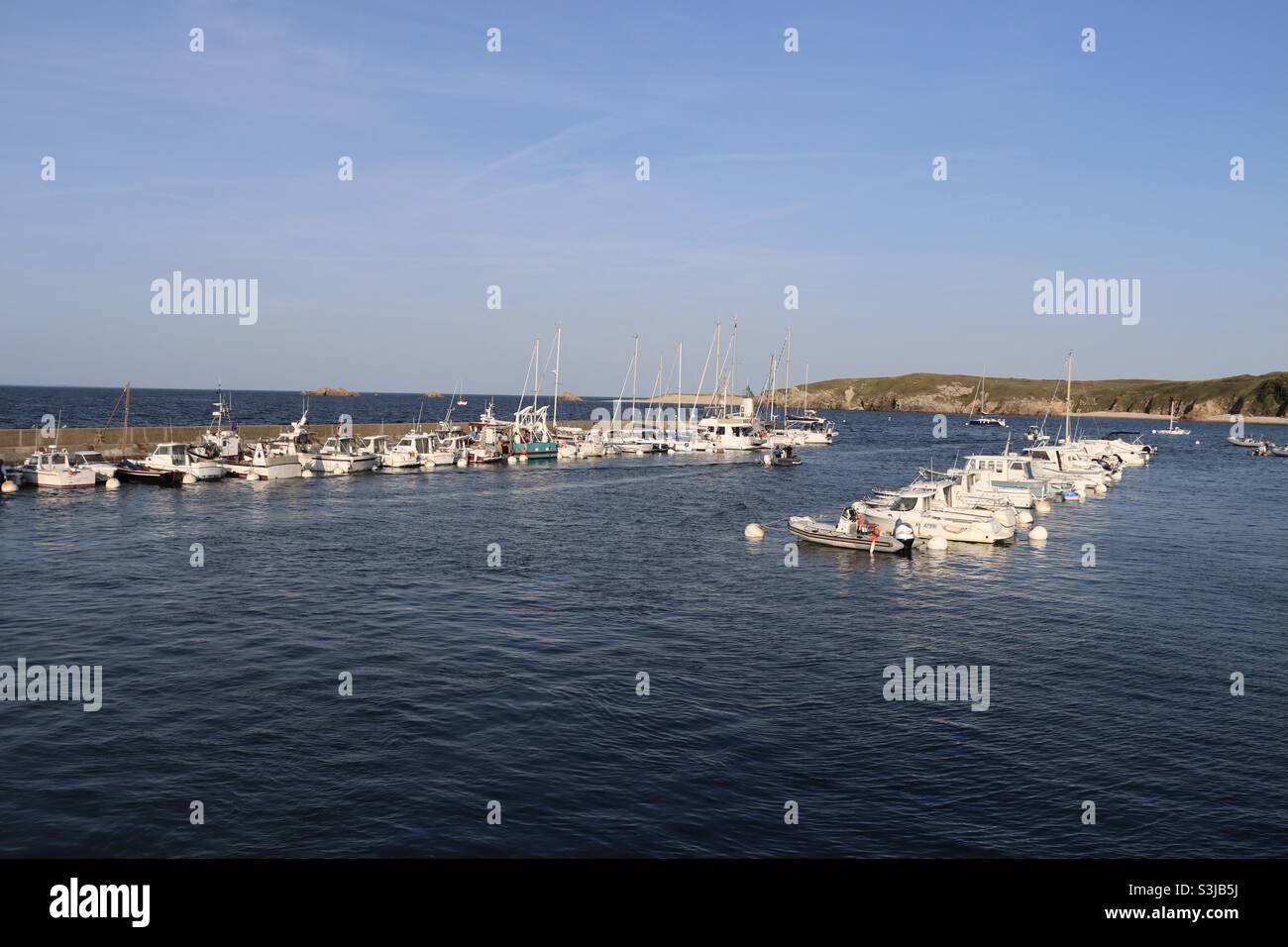 The harbor of the island of Houat in Brittany, in the French department of Morbihan, on august 2021 - Smartphone Captured Stock Image