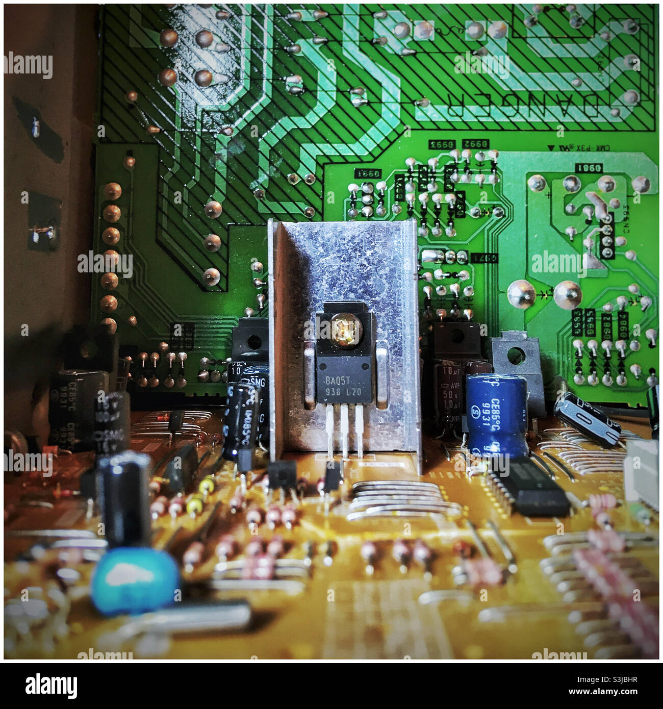 circuit board with robot-like figure - Smartphone Captured Stock Image