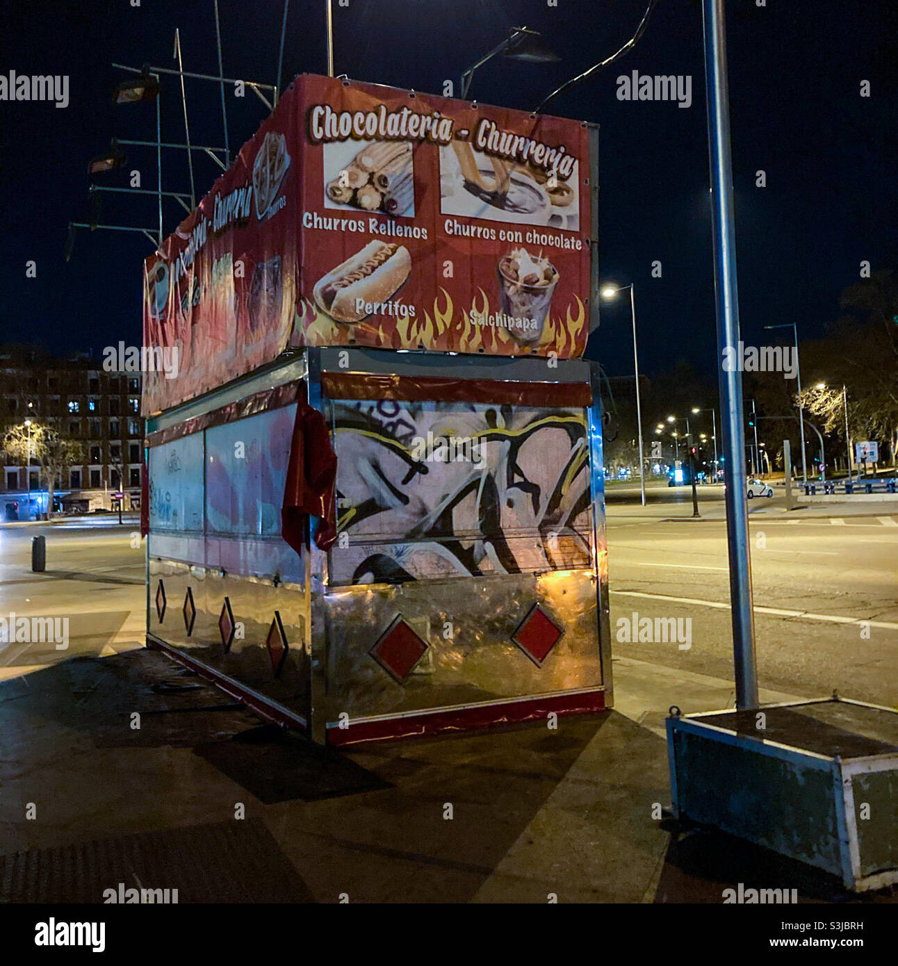 Closed churros stand outside Atocha train Stationen Madrid,Spain  at night - Smartphone Captured Stock Image