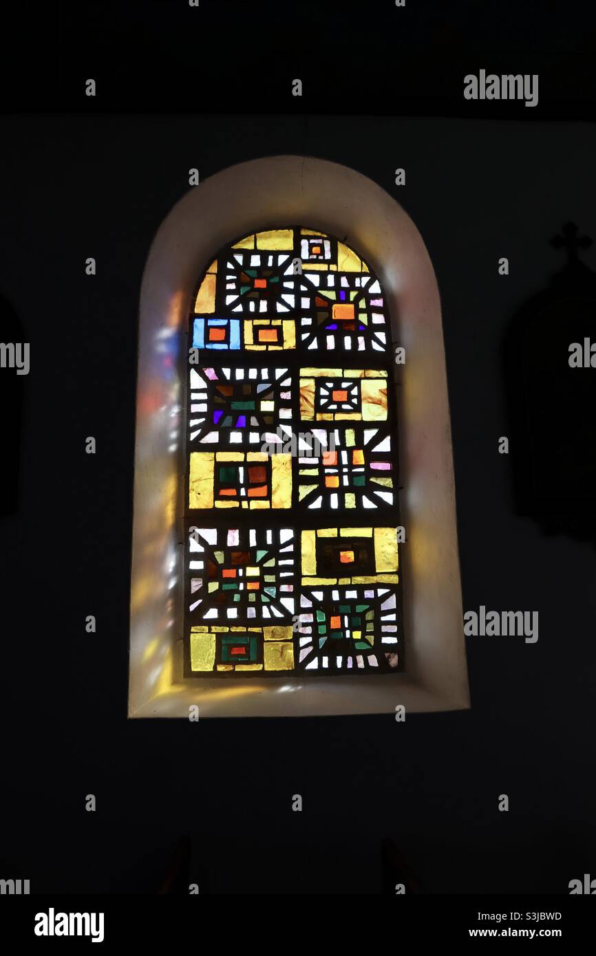 Stained glass windows in the church at the island of Hoedic in Brittany, France - Smartphone Captured Stock Image