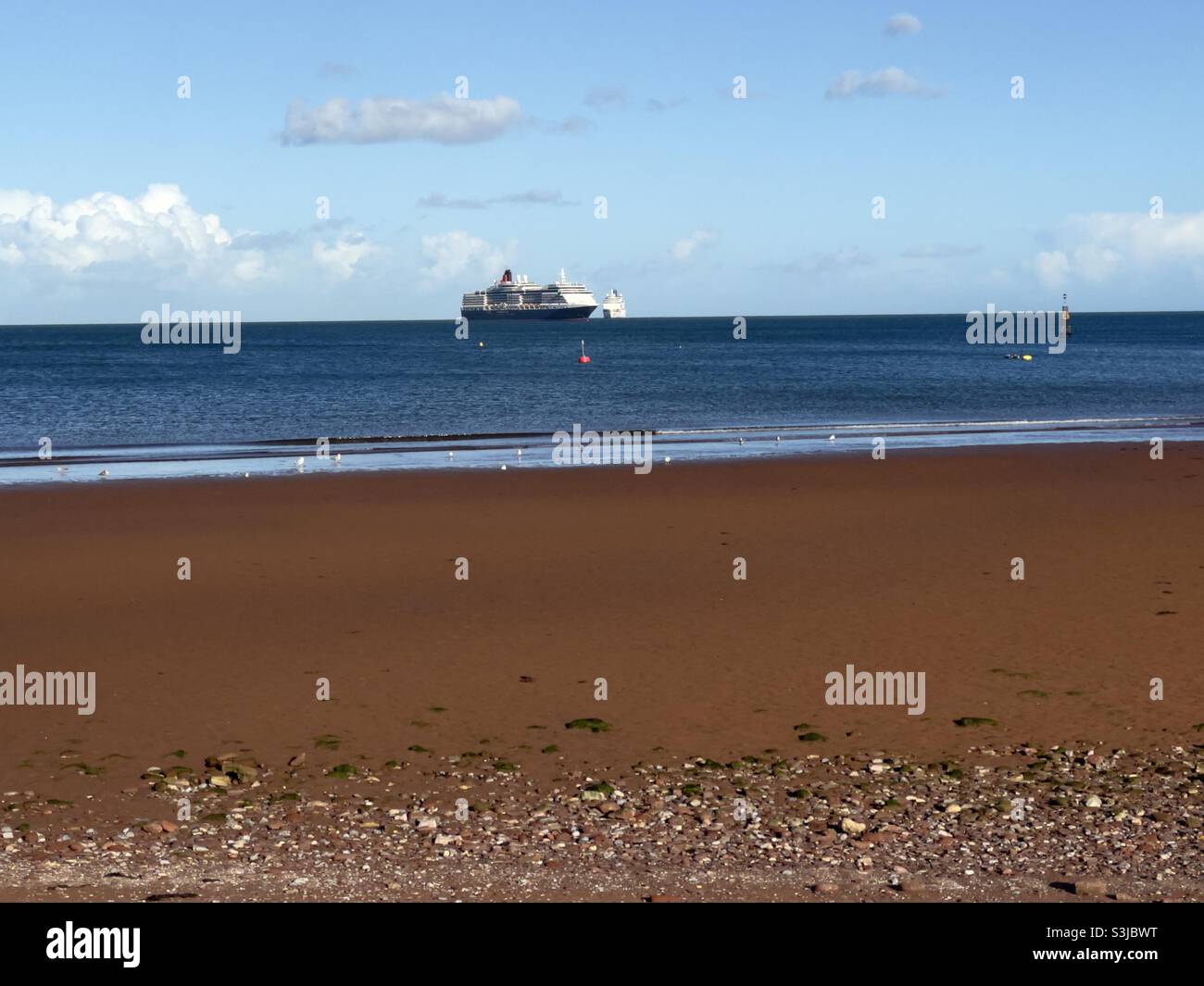 Cunard Queen Victoria and P&O Arcadia ships anchored off Torquay on around U.K. cruise. - Smartphone Captured Stock Image
