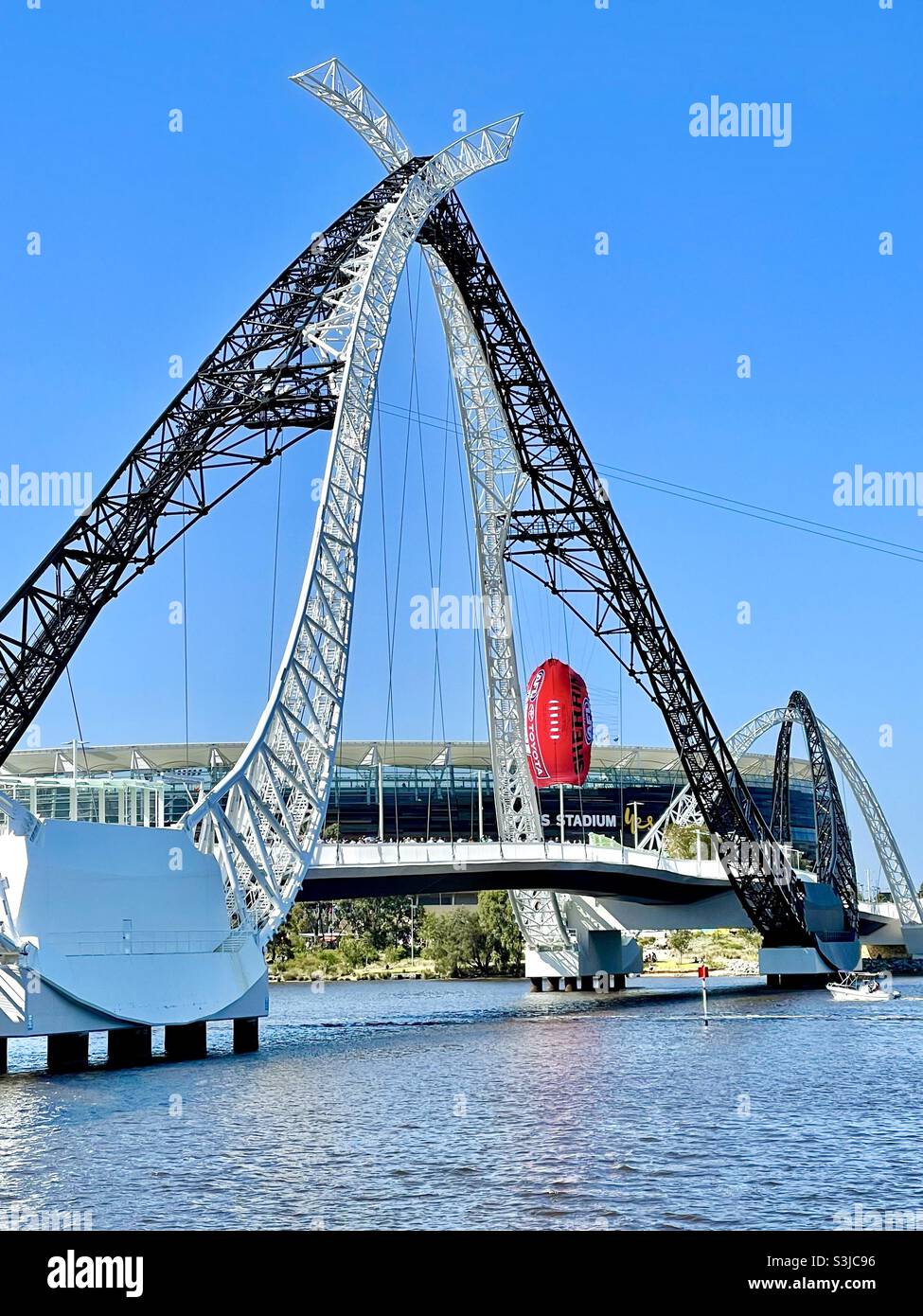 2021 AFL Grand Final at Optus Stadium, Matagarup Bridge with a suspended Sherrin football balloon, over the Swan River Perth Western Australia. Stock Photo