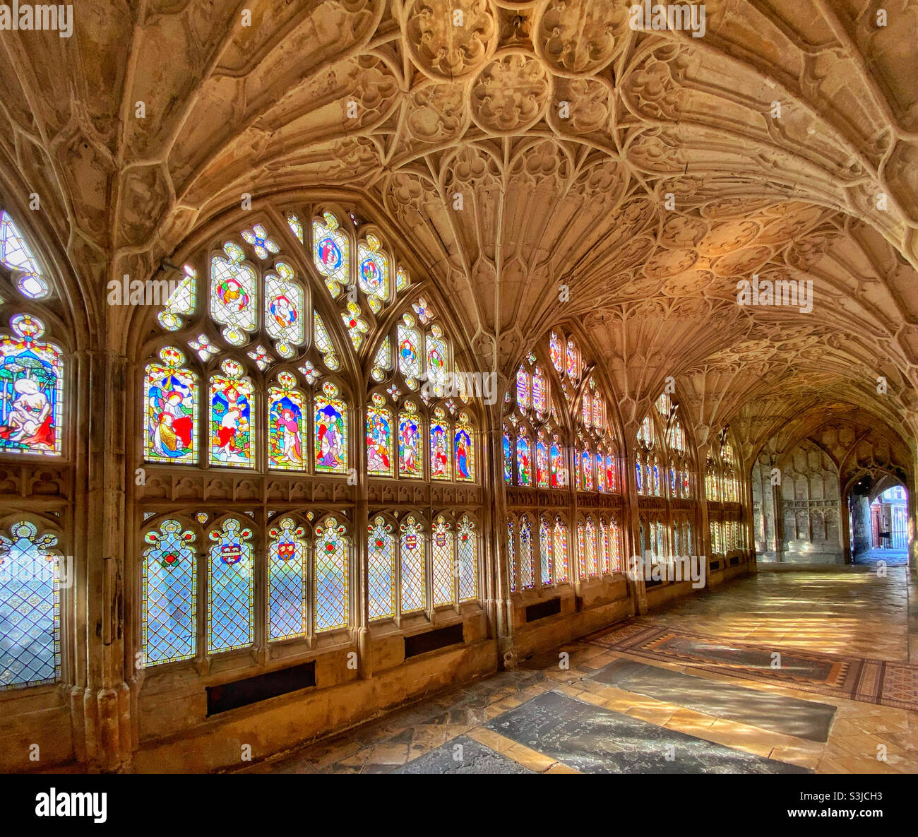 The cloisters area of Gloucester Cathedral in England, UK. Amazing stained glass windows and fan vaulted ceilings. This area was used as locations for two Harry Potter movies. Photo ©️ COLIN HOSKINS. - Smartphone Captured Stock Image