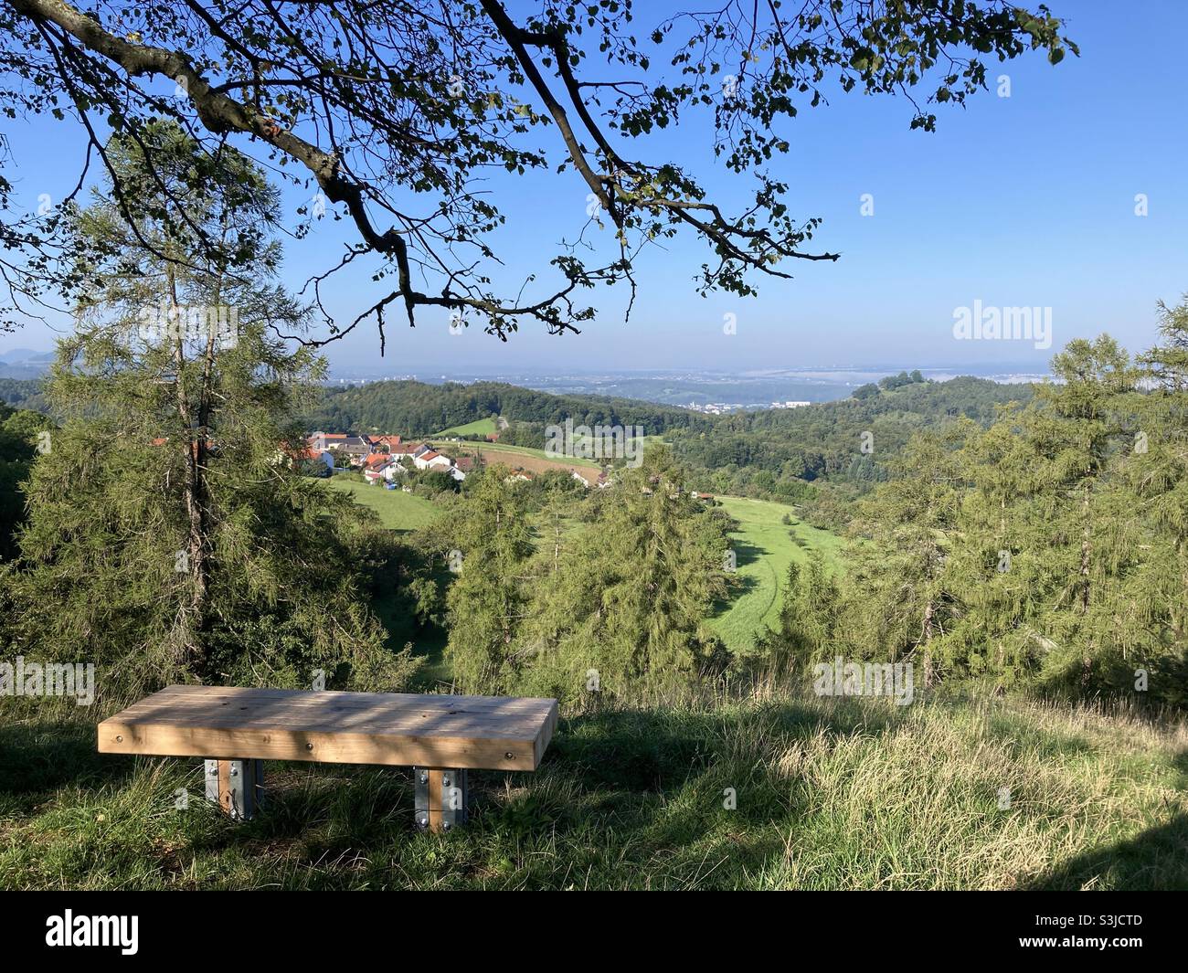 Bench overlooking idyllic hilly landscape in the Swabian Alps in Southern Germany - Smartphone Captured Stock Image
