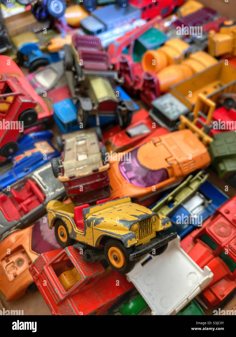 Old toy cars in top box
