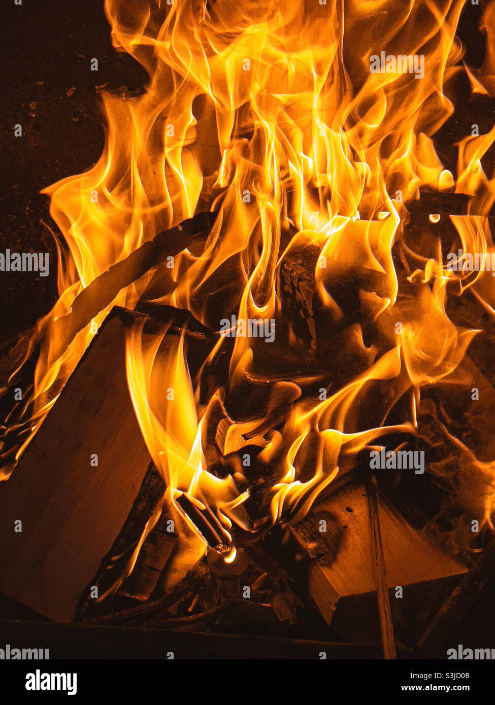 Wood logs burning - Smartphone Captured Stock Image