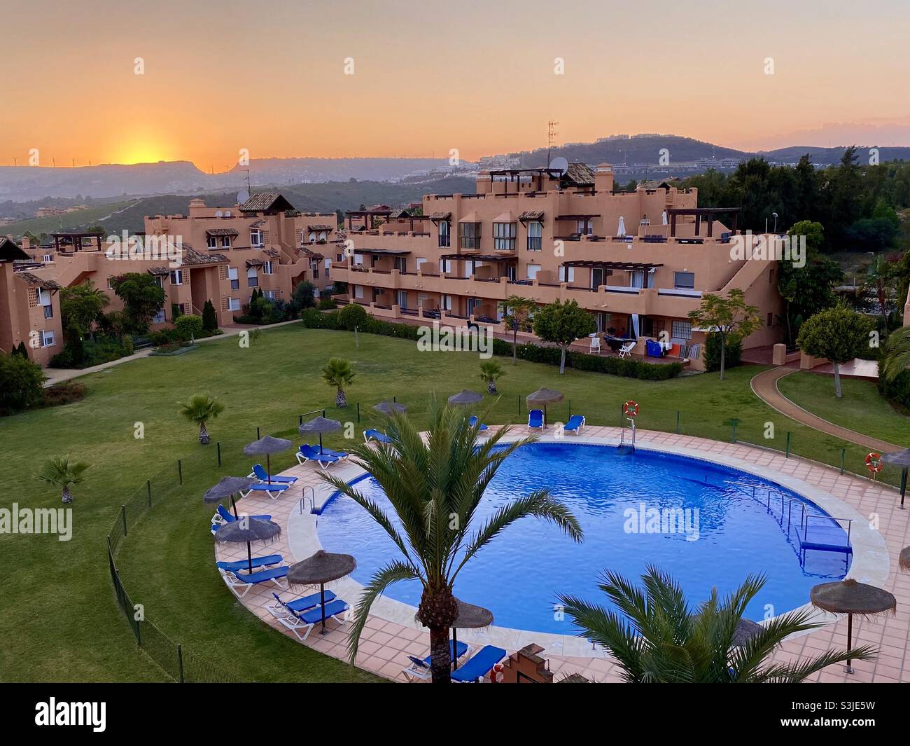 Aerial view of the sun setting over residential property at Casares Costa in southern Spain Stock Photo