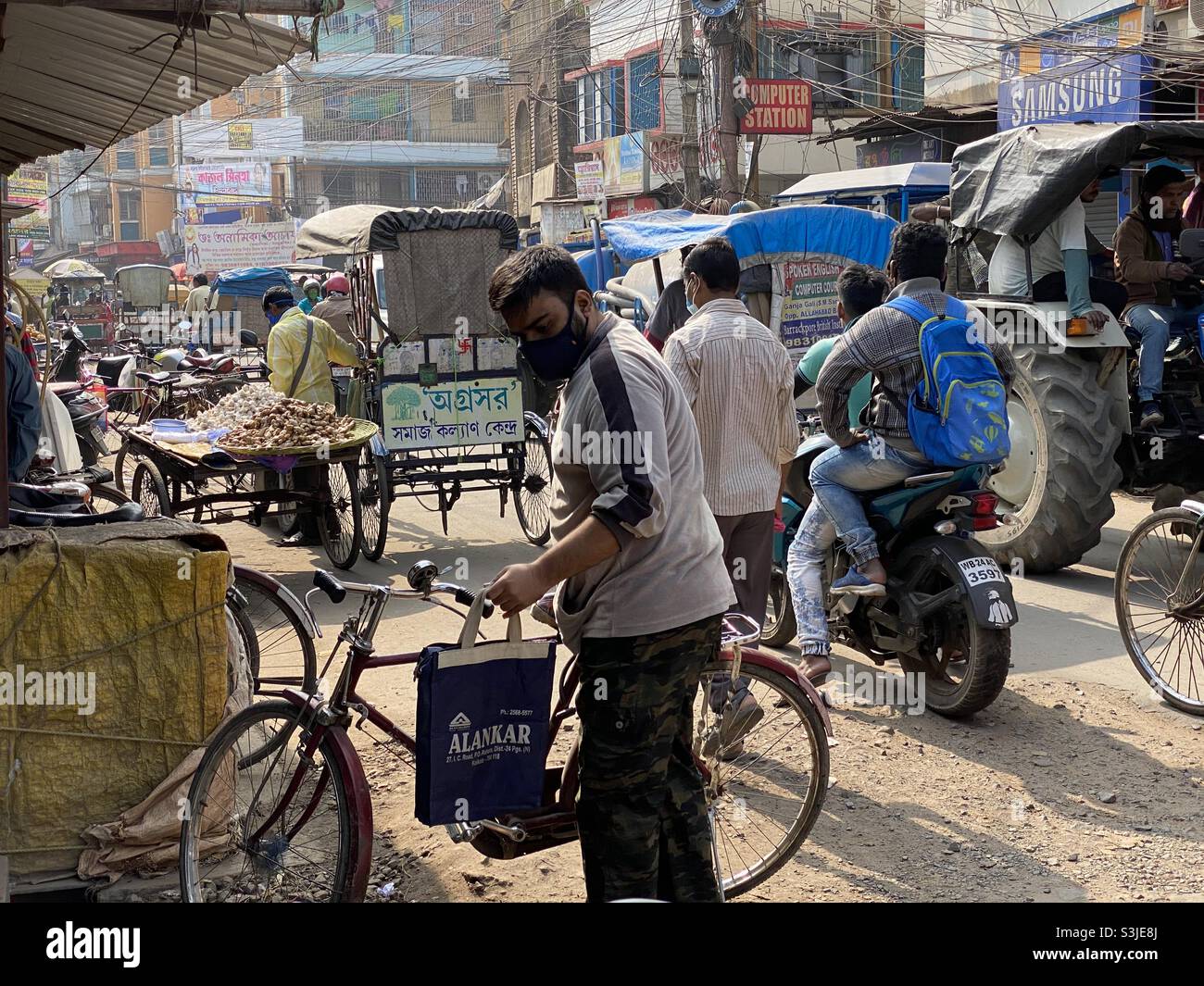 People are busy in the street of a small city - Smartphone Captured Stock Image