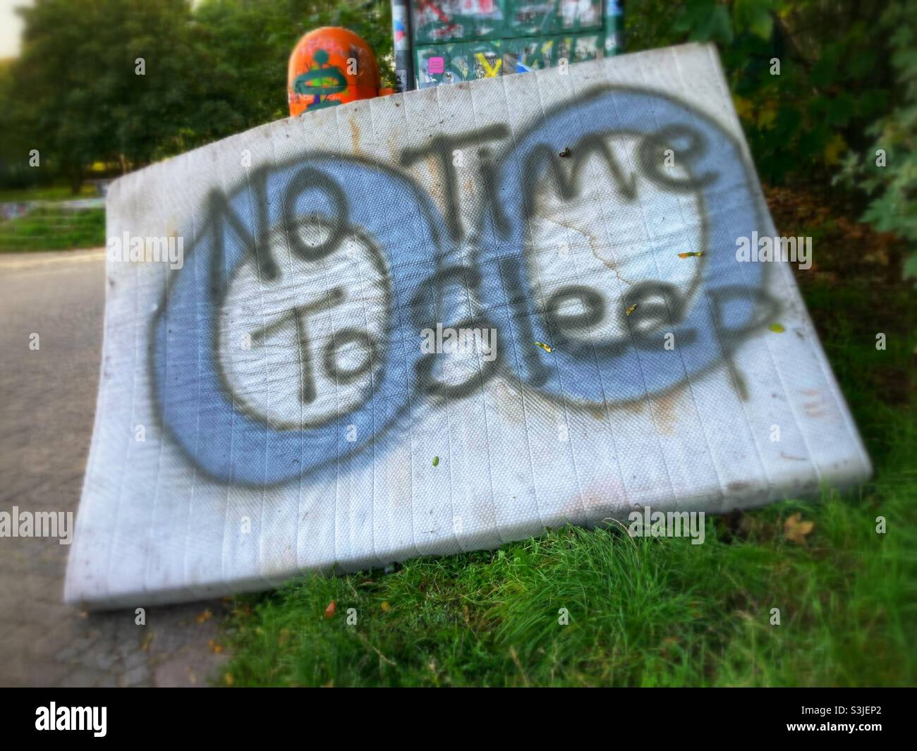 Mattress with the Graffiti No Time to sleep sprayed on it - Smartphone Captured Stock Image