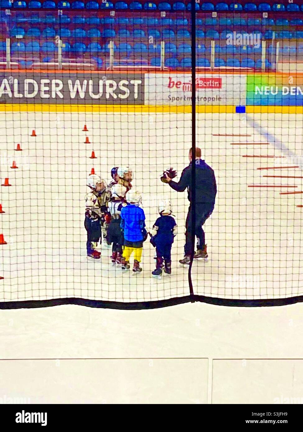 Children playing ice hockey - Smartphone Captured Stock Image