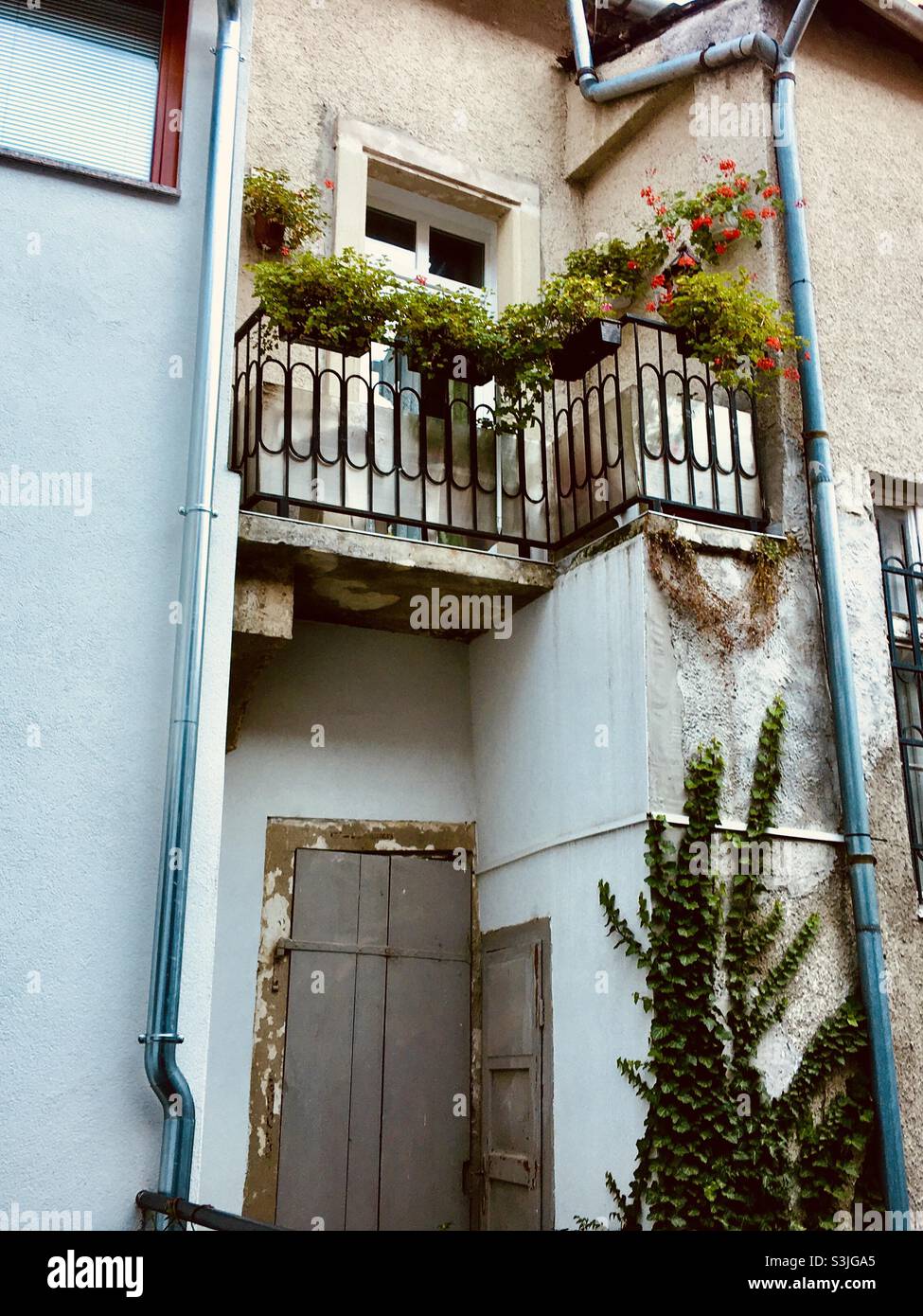 Small balcony of old house near town wall, Sopron, Hungary - Smartphone Captured Stock Image