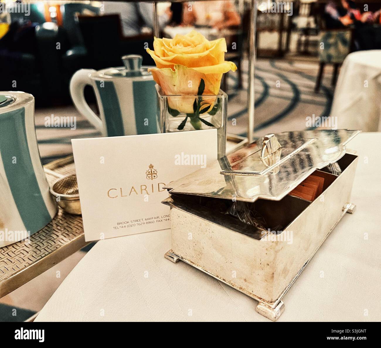 Table with Silver Sugar box at Claridges Hotel in Mayfair London at Afternoon tea - Smartphone Captured Stock Image