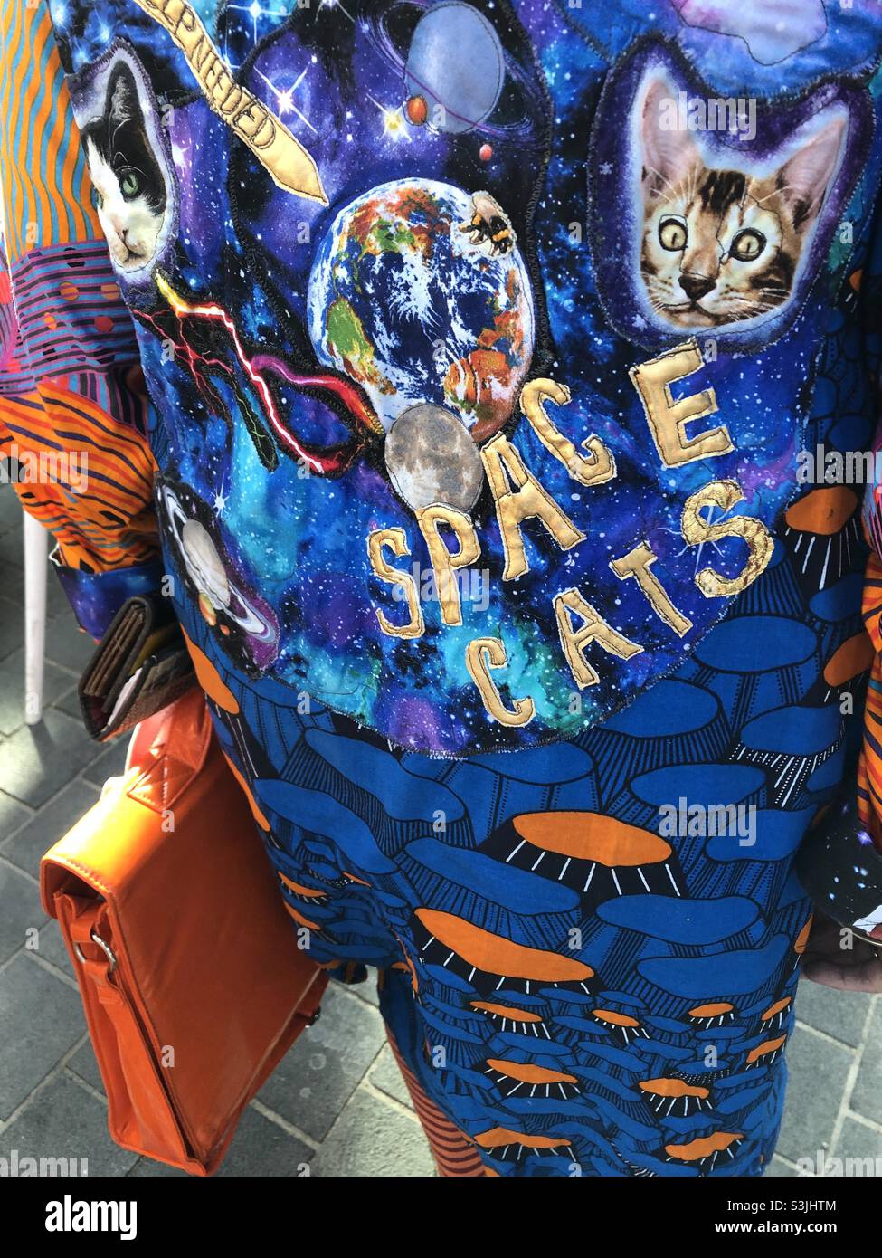 Unique fashion at Spitalfields market dress with Space Cats on fabric - Smartphone Captured Stock Image