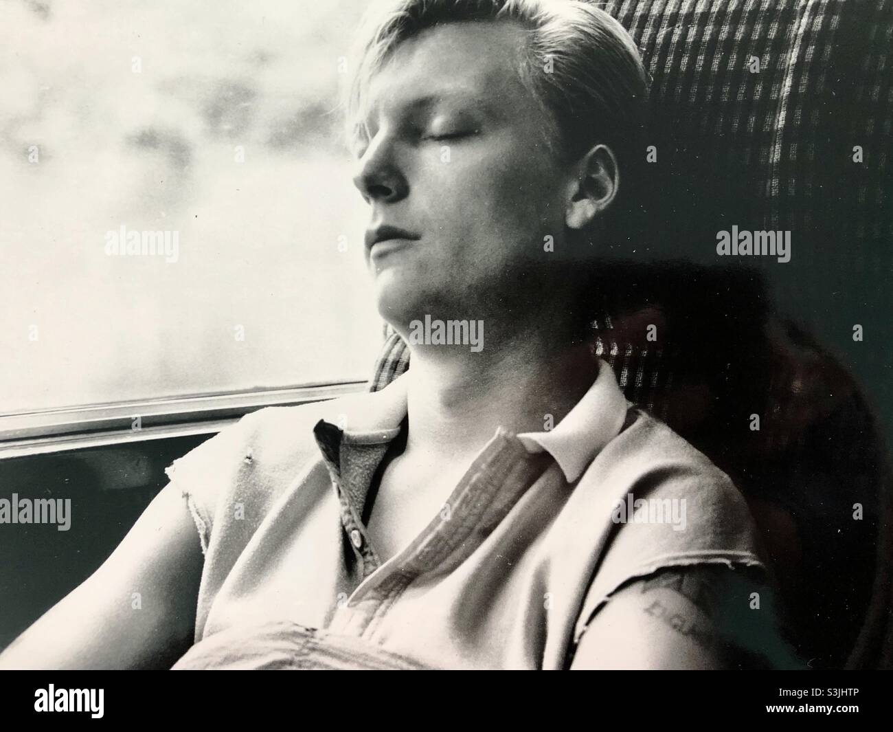 Sleeping man on London train Stock Photo