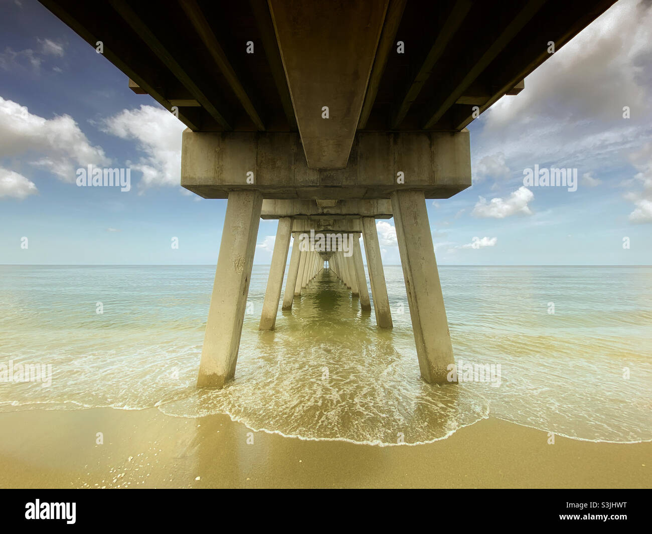 Underneath pier in Gulf of Mexico Stock Photo
