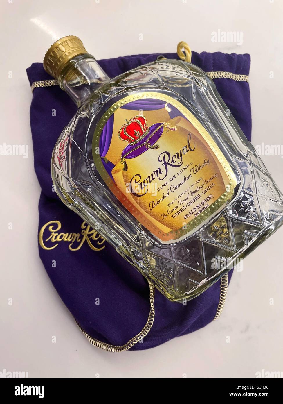 Crown royal empty bottle and velvet carrying bag, flat lay - Smartphone Captured Stock Image