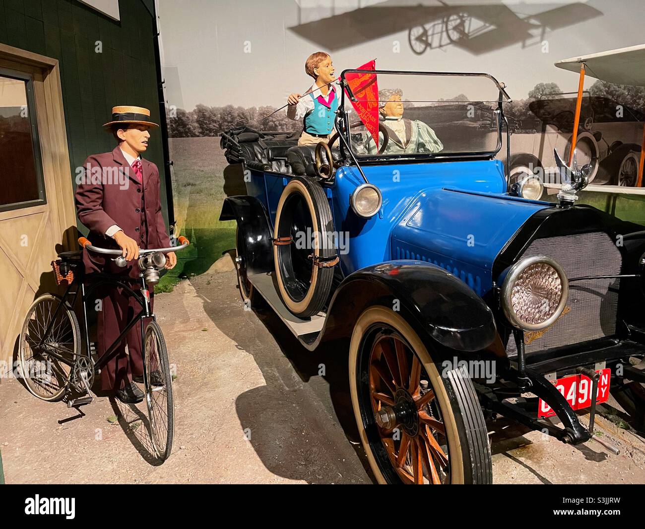 Model T automobile and vintage bicycle display at the cradle of aviation Museum, 2021, Garden City Long Island, New York state, USA - Smartphone Captured Stock Image
