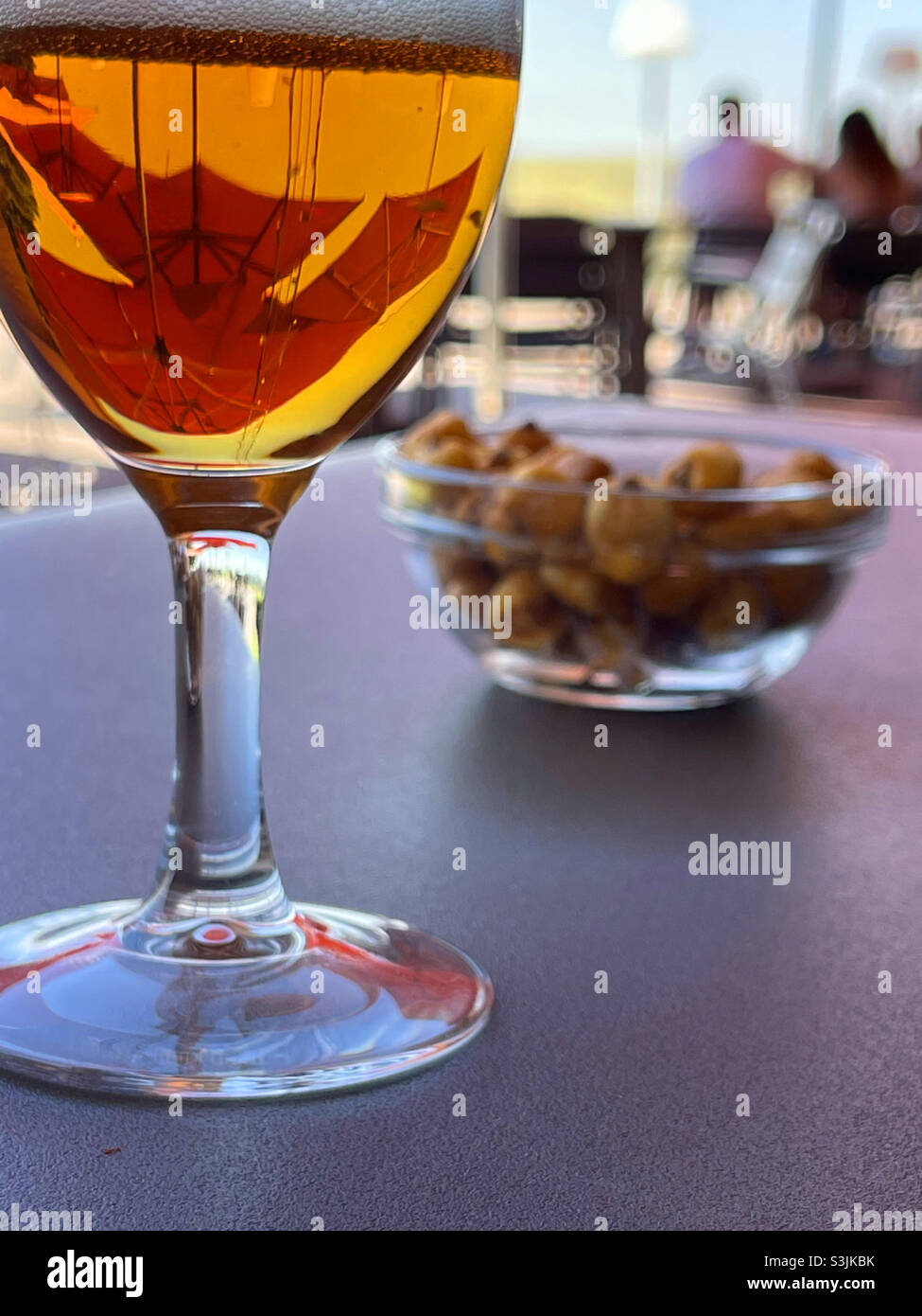 Glass of beer in a terrace. - Smartphone Captured Stock Image