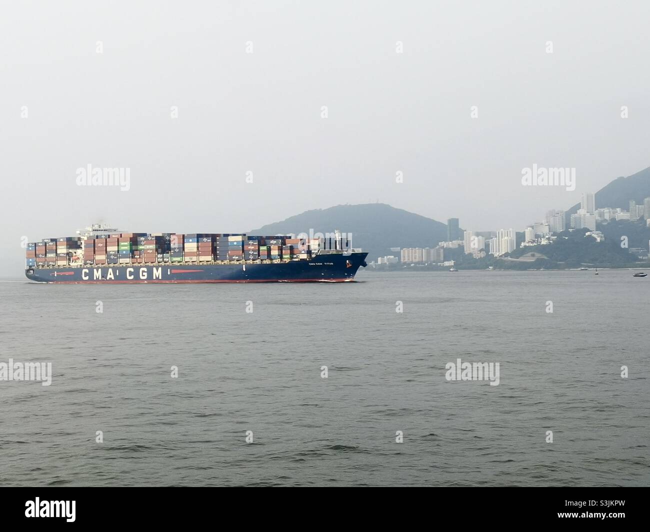 CMA CGM container ship crossing the East Lamma channel in Hong Kong. - Smartphone Captured Stock Image