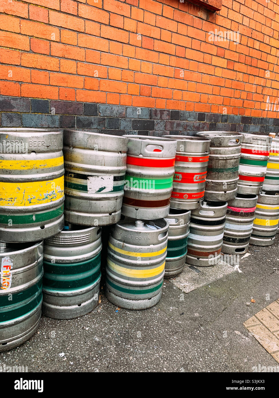 Empty aluminium beer barrels waiting collection Stock Photo Alamy
