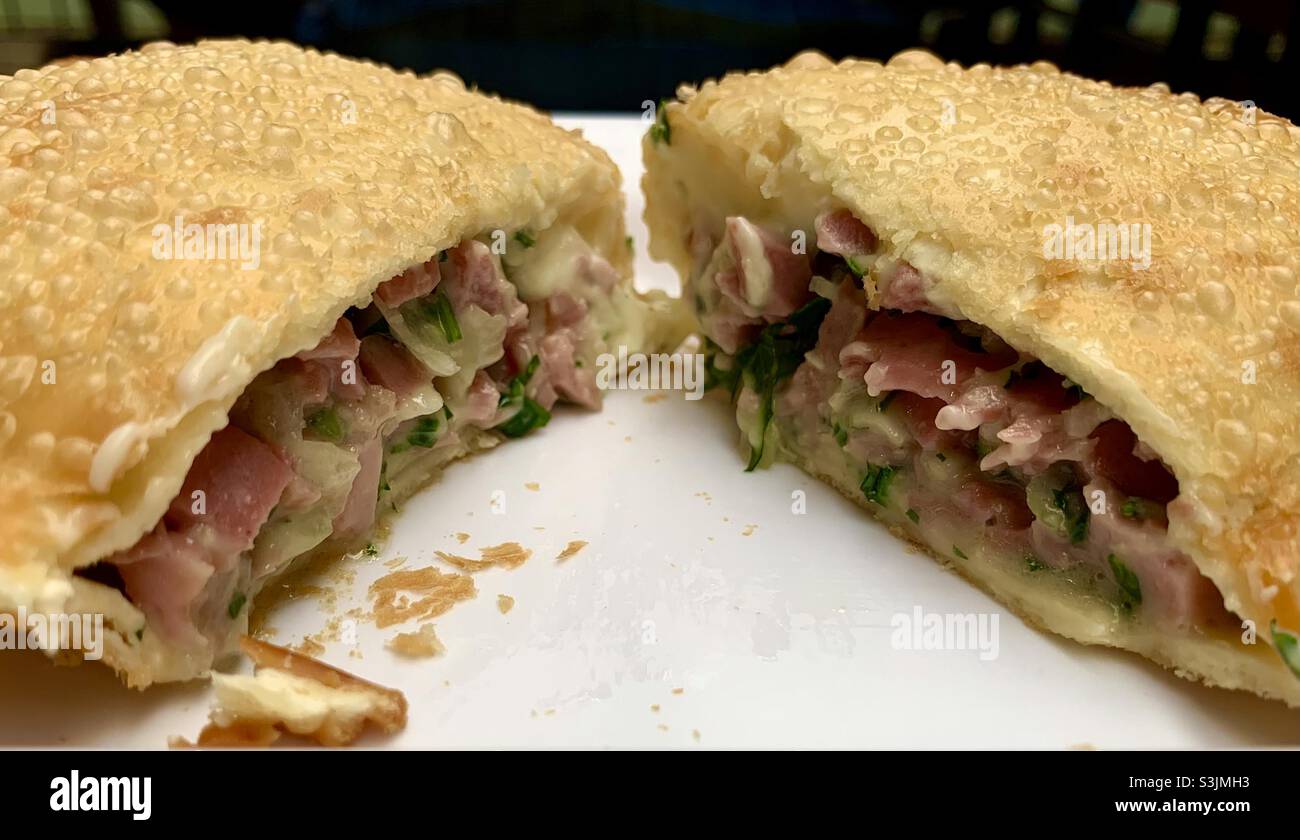 Traditional Brazilian pastry (Pastel) with ham and cheese Stock Photo