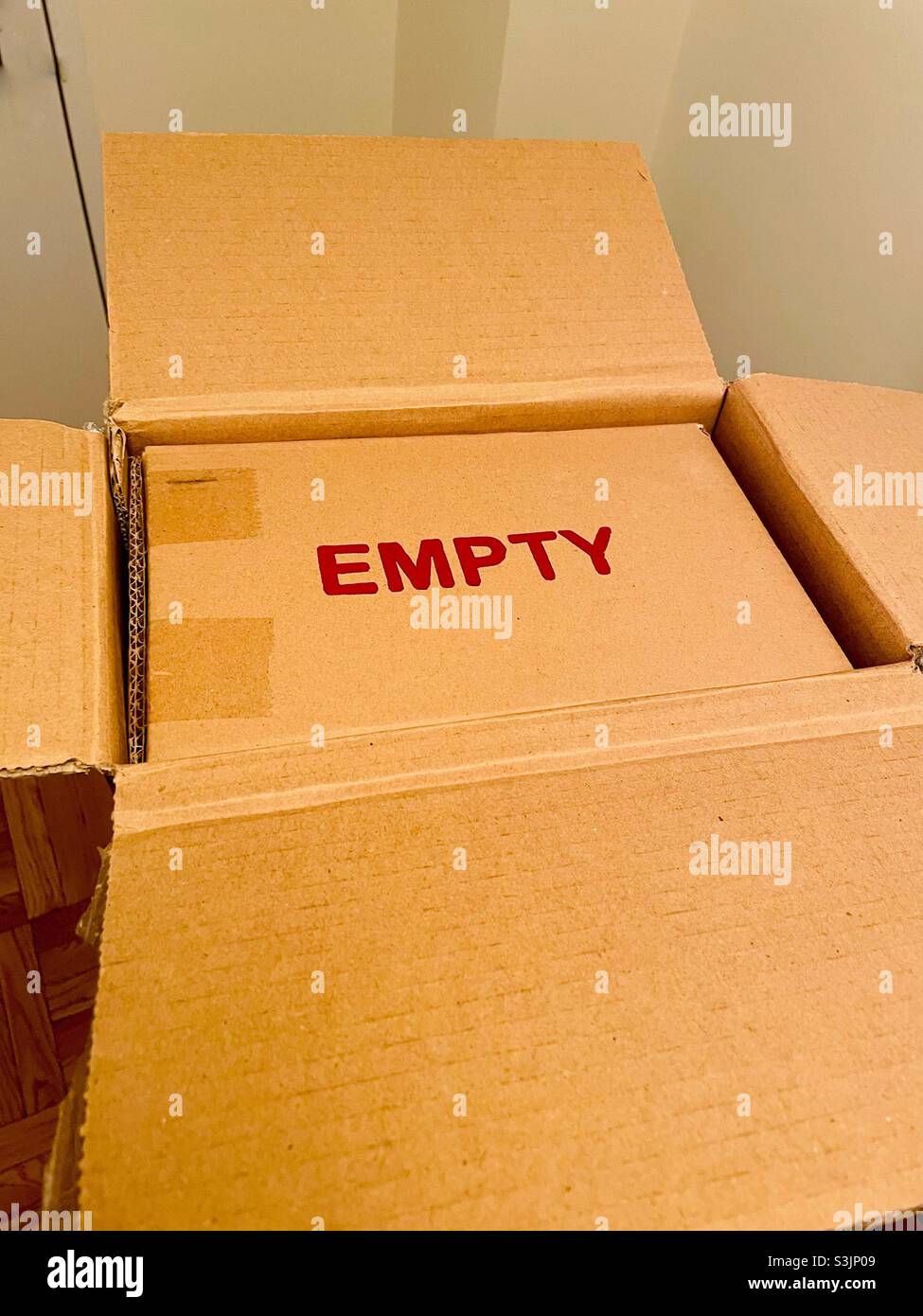Cardboard box that says empty - Smartphone Captured Stock Image