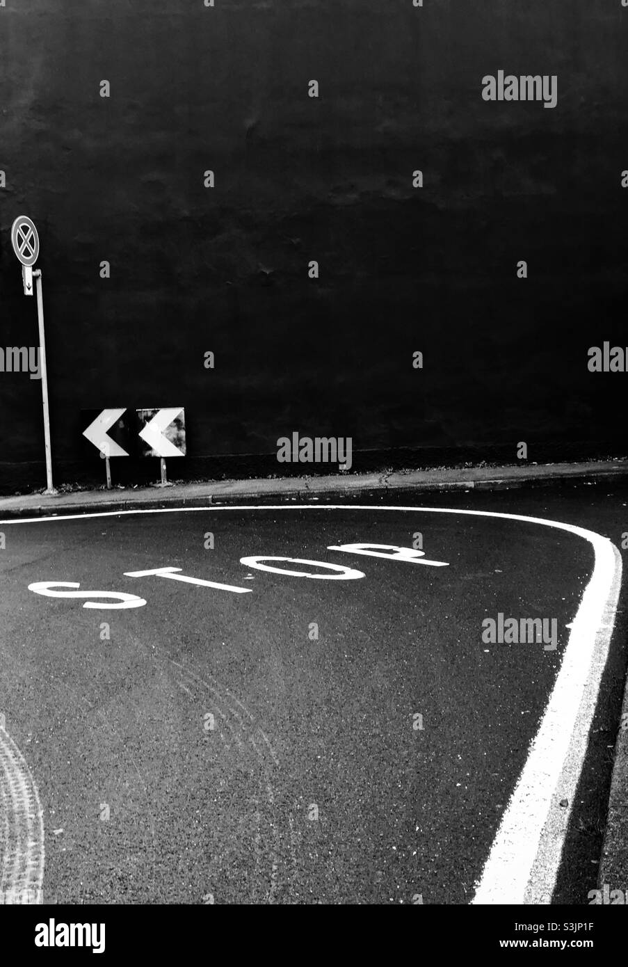stop road sign wall black danger - Smartphone Captured Stock Image