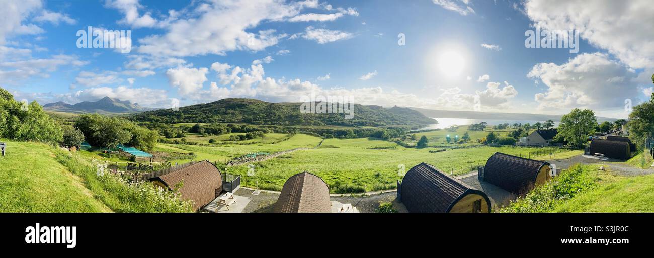 Panoramic from the Ben Loyal Hotel, Tongue, Scotland. Camping pods in the foreground with Ben Loyal, Castle Varrich and Kyle of Tongue in the view. North Coast 500. Stock Photo
