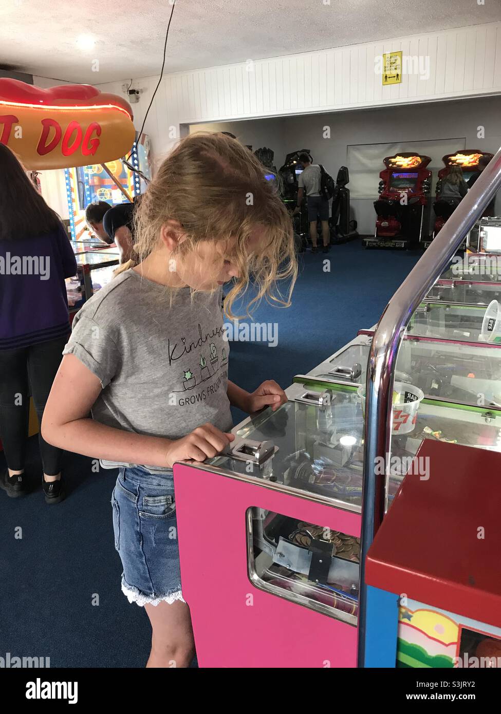 Child playing on an arcade game Stock Photo Alamy