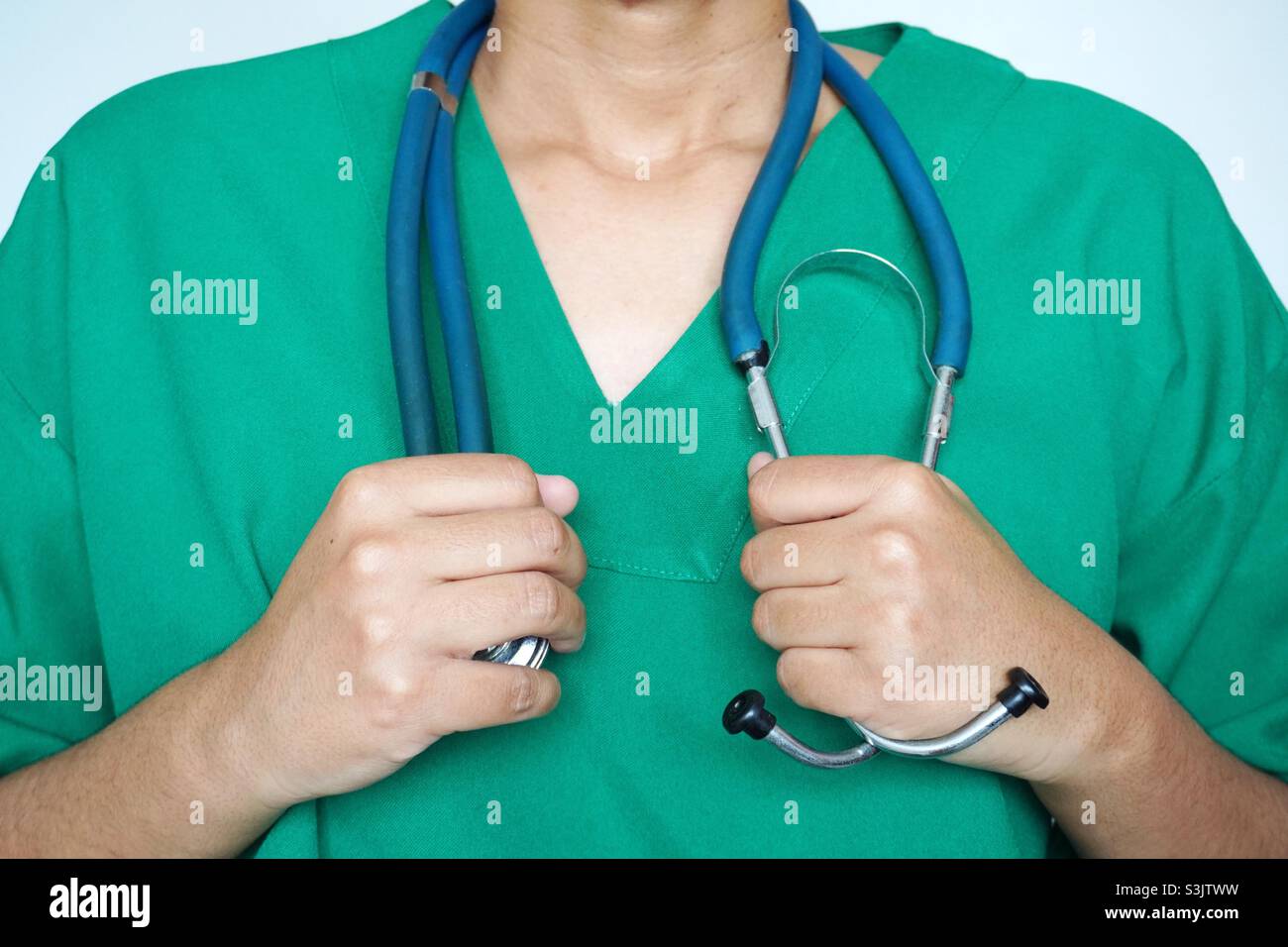 Doctor with scrubs and stethoscope Stock Photo