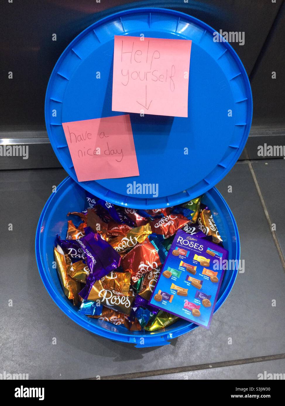 Random act of kindness. Chocolates left in lift. Stock Photo