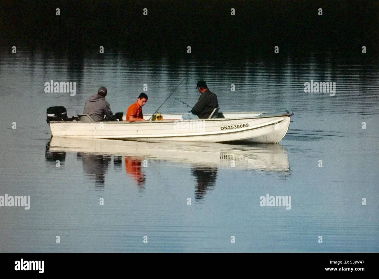 Sport fishing on a calm lake - Smartphone Captured Stock Image