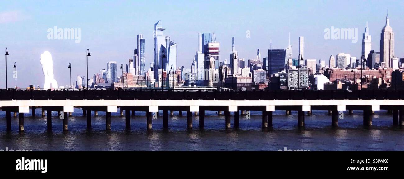 Water’s Soul faces the Manhattan skyline on a bright sunny day. Stock Photo