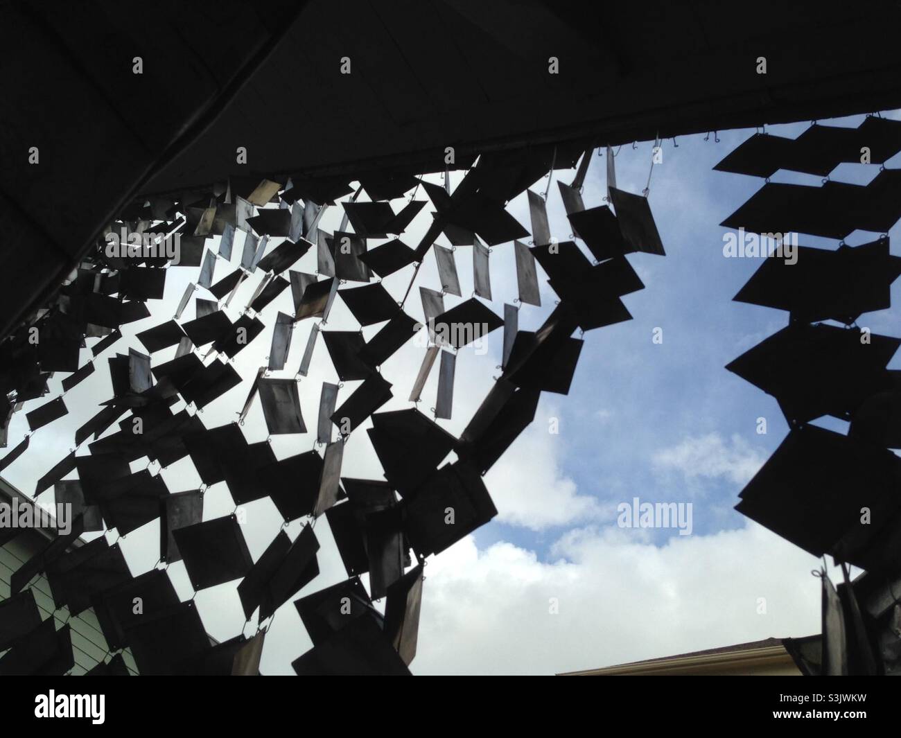 Wind chimes at Houston’s Beer Can House made of beer cans Stock Photo Alamy