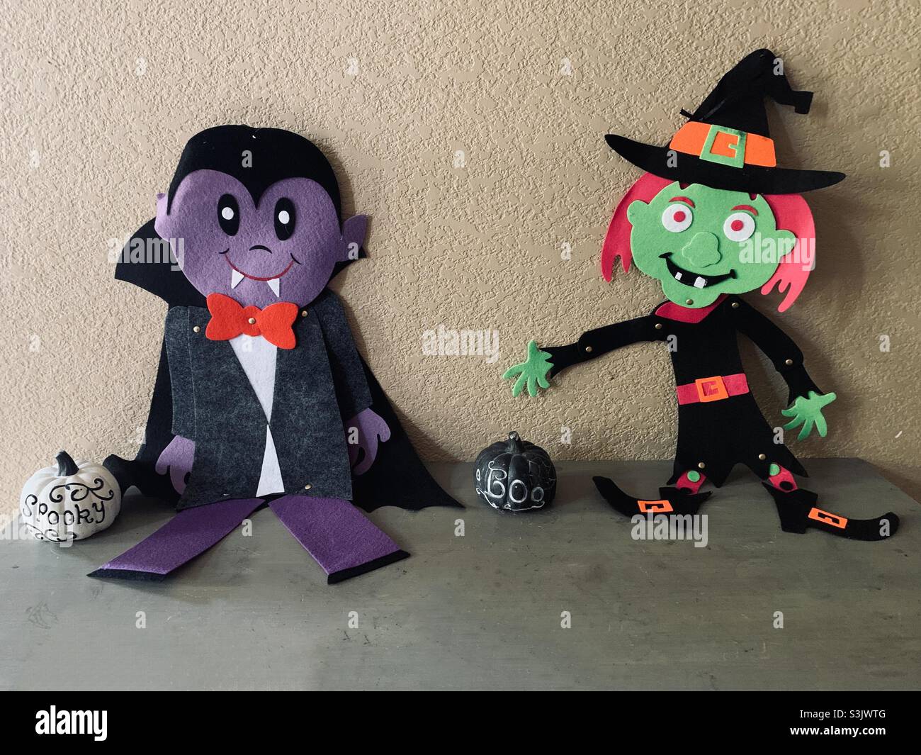 Halloween vampire, witch and pumpkins on display Stock Photo