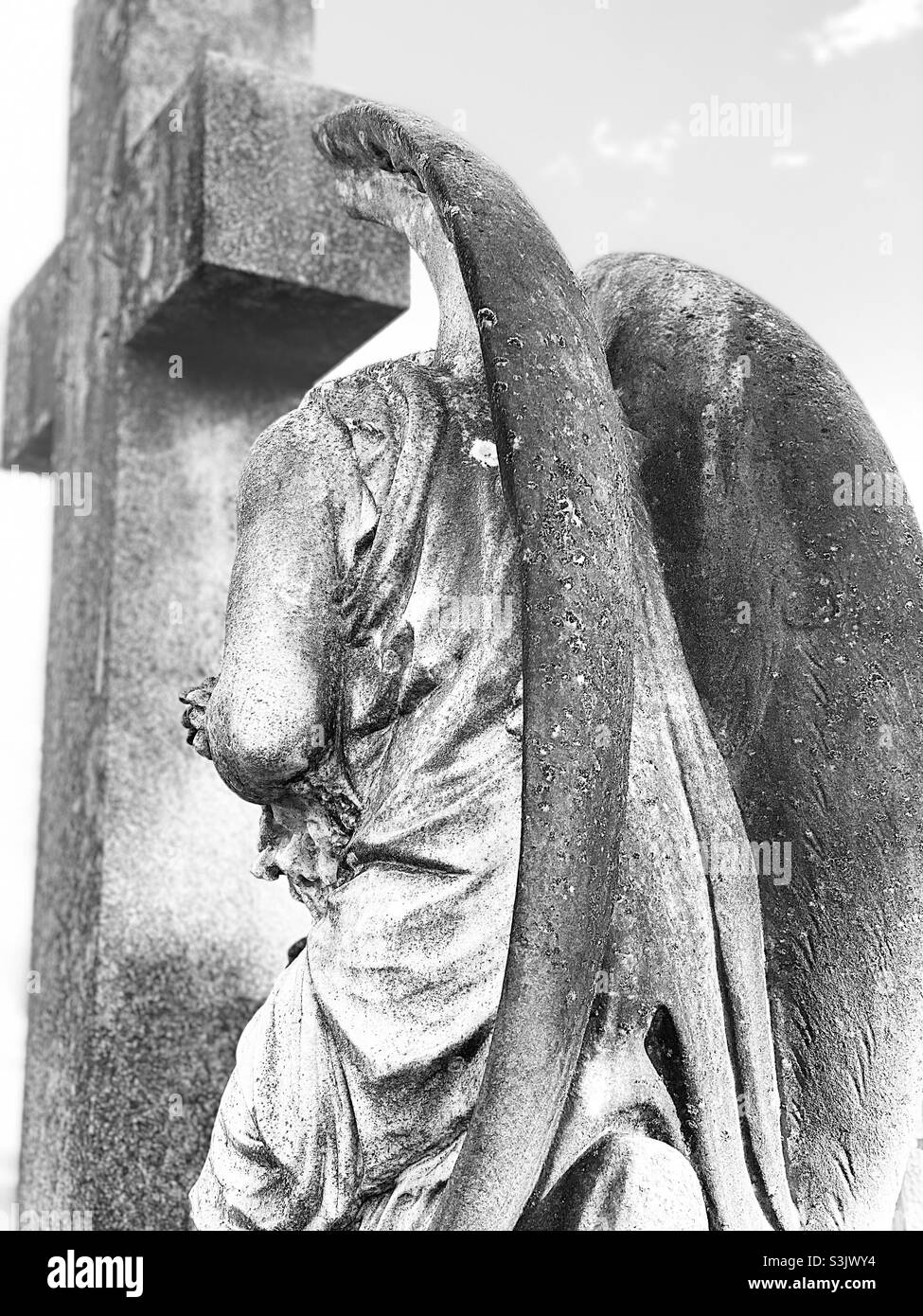 Weeping angel with wings spread in silvertone Stock Photo