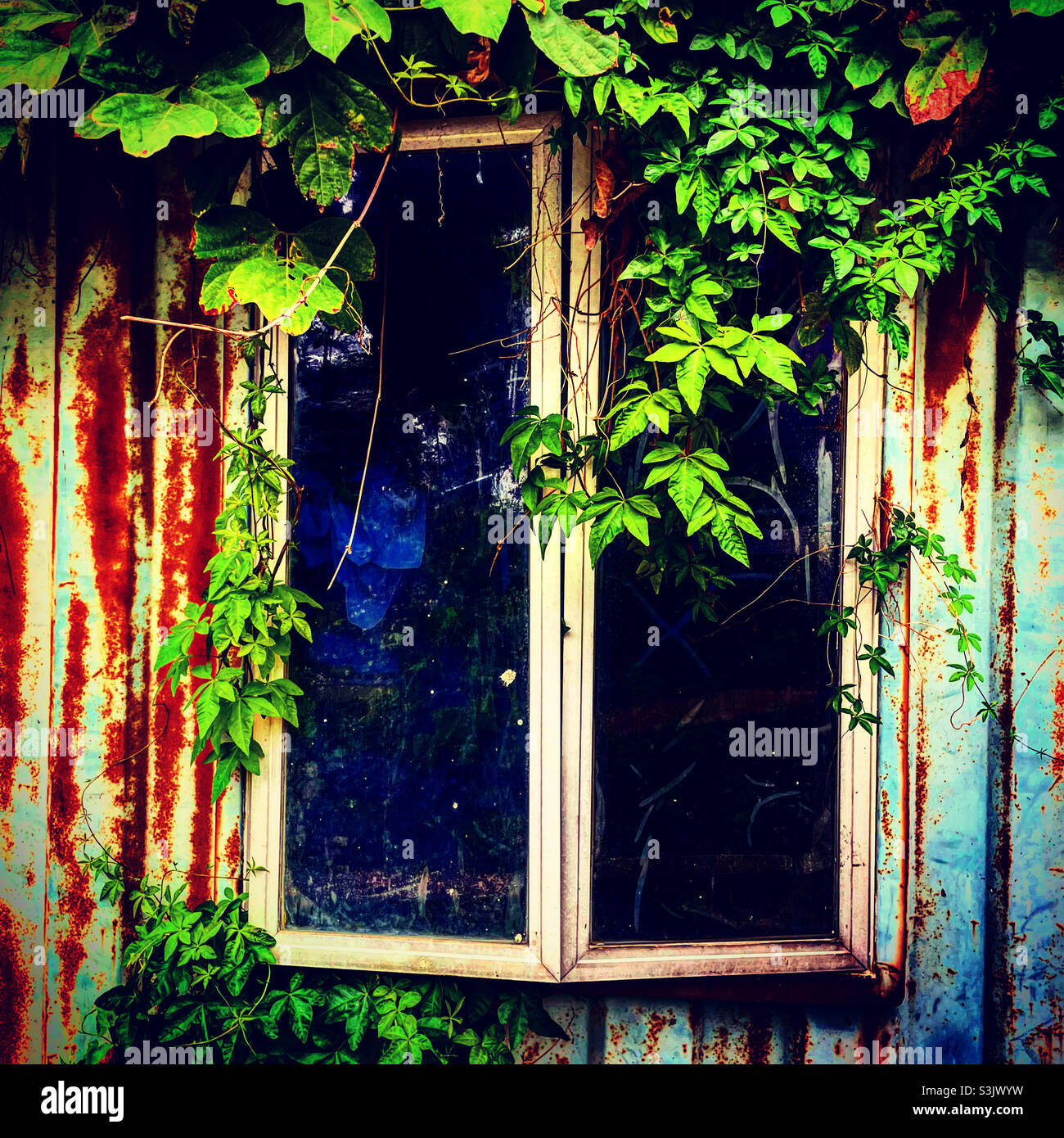 Window if a rusted container which is used as a house. Stock Photo
