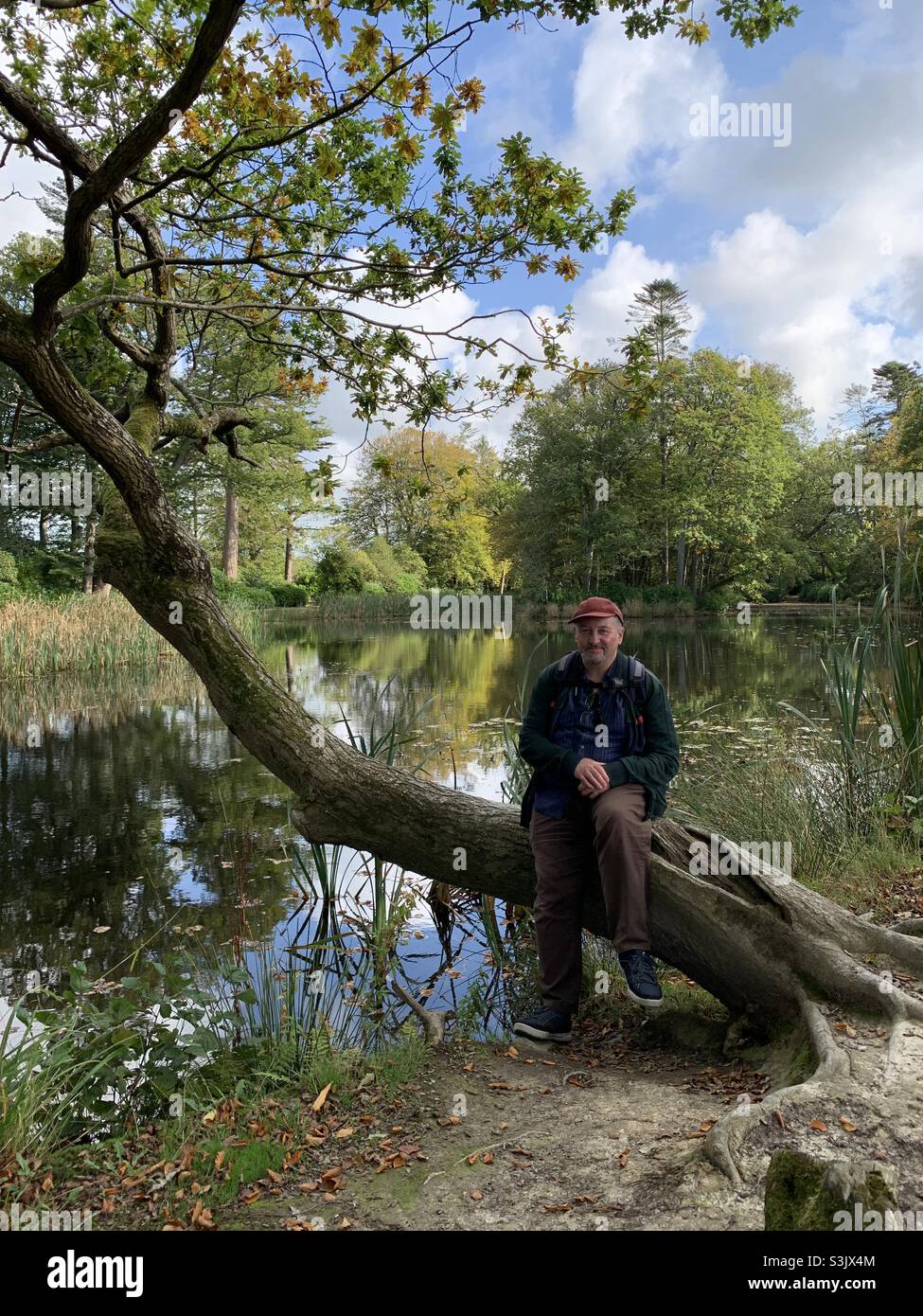 Happy man in the grounds of Llanerchearon by the lake - Smartphone Captured Stock Image