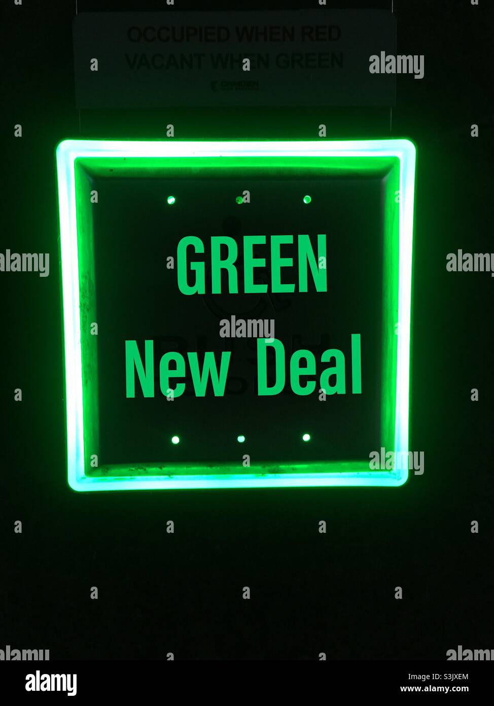 Green New Deal button. Part of the campaign about climate change, no new coal, solar, wind, and other alternate energy sources. Build back better, green, greener. Words, Colors, no images. Direct. - Smartphone Captured Stock Image