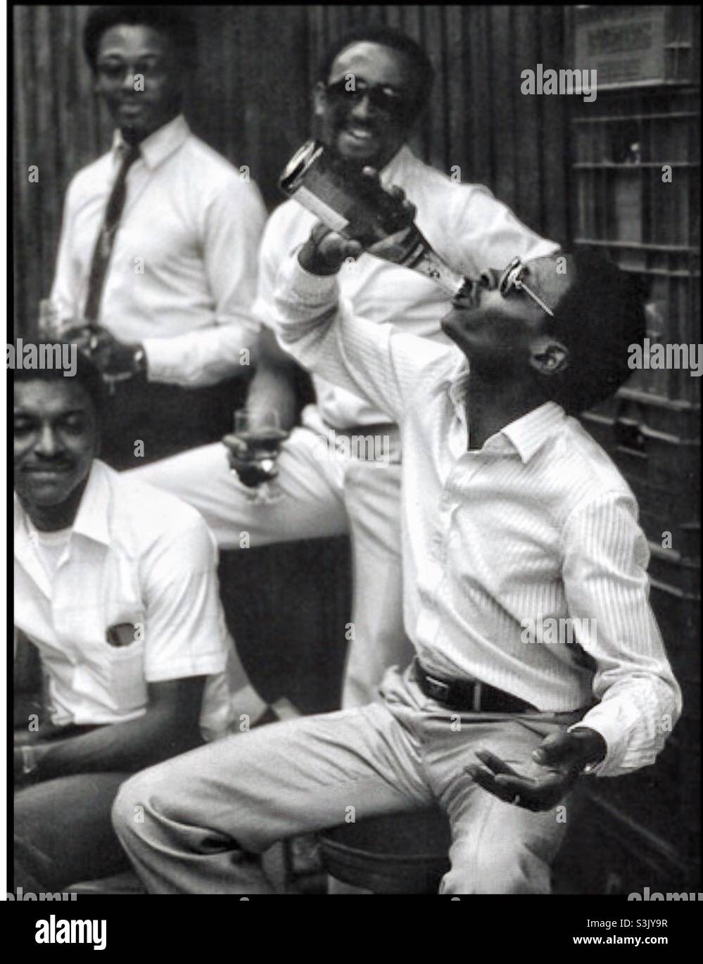 Young Black men enjoying a drink - Smartphone Captured Stock Image