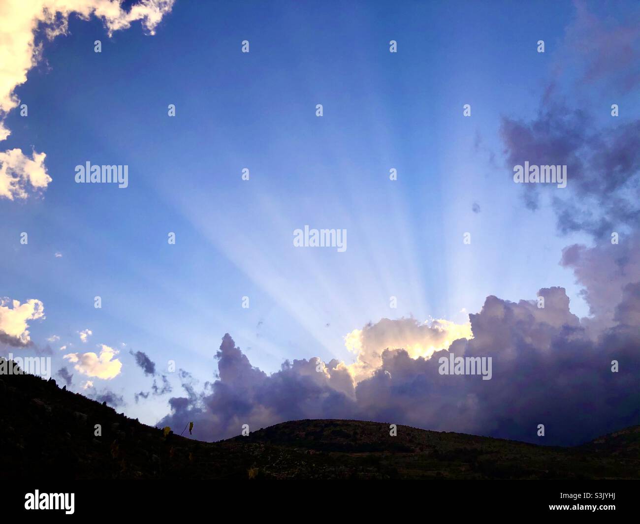 Sunset In Culla, Spain with light rays through the clouds Stock Photo