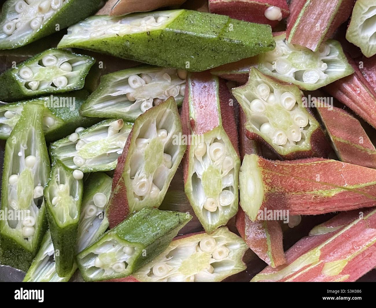 Mixed pink and green pods of okra. - Smartphone Captured Stock Image