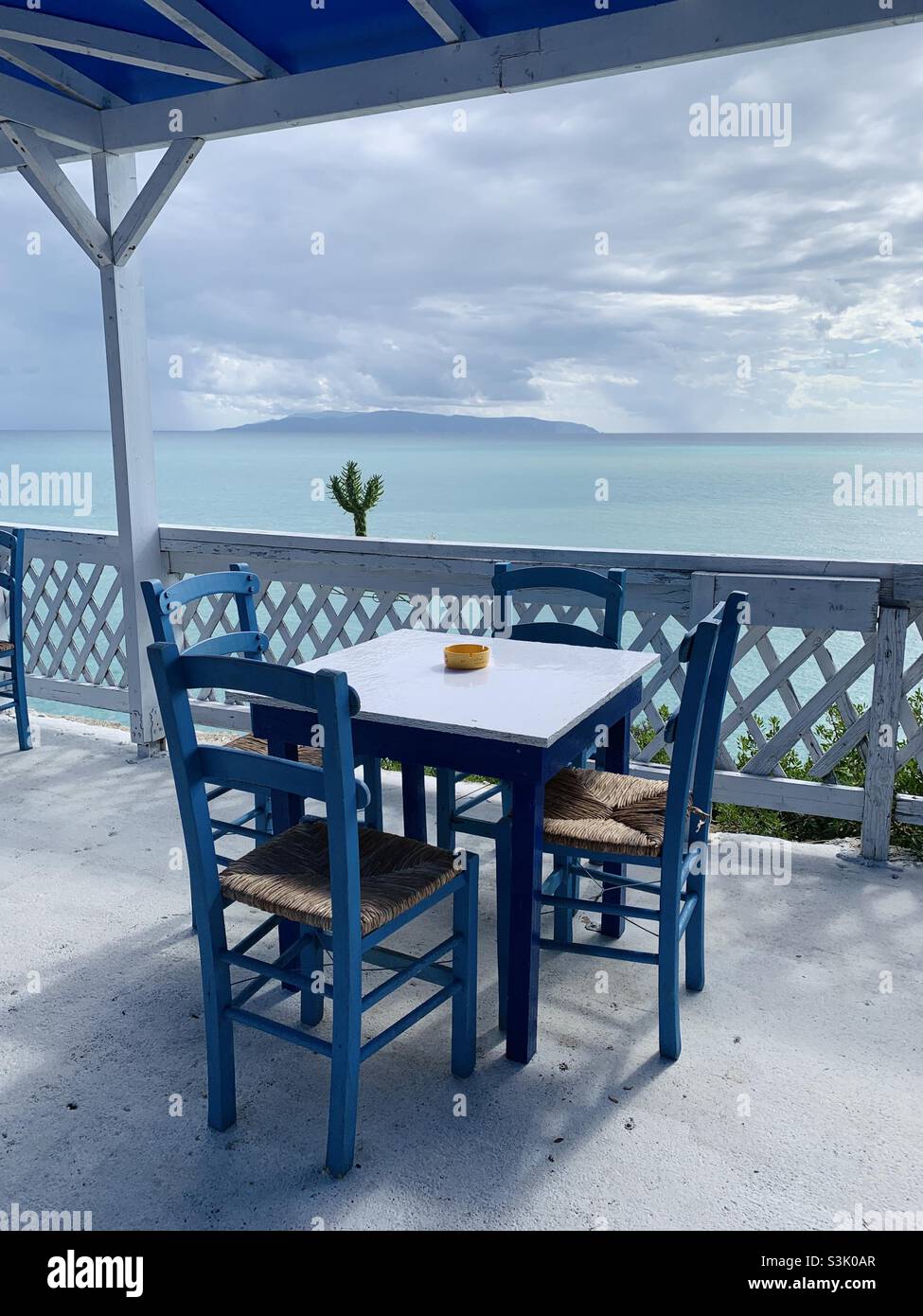 Empty table at restaurant in Greece kefalonia - Smartphone Captured Stock Image