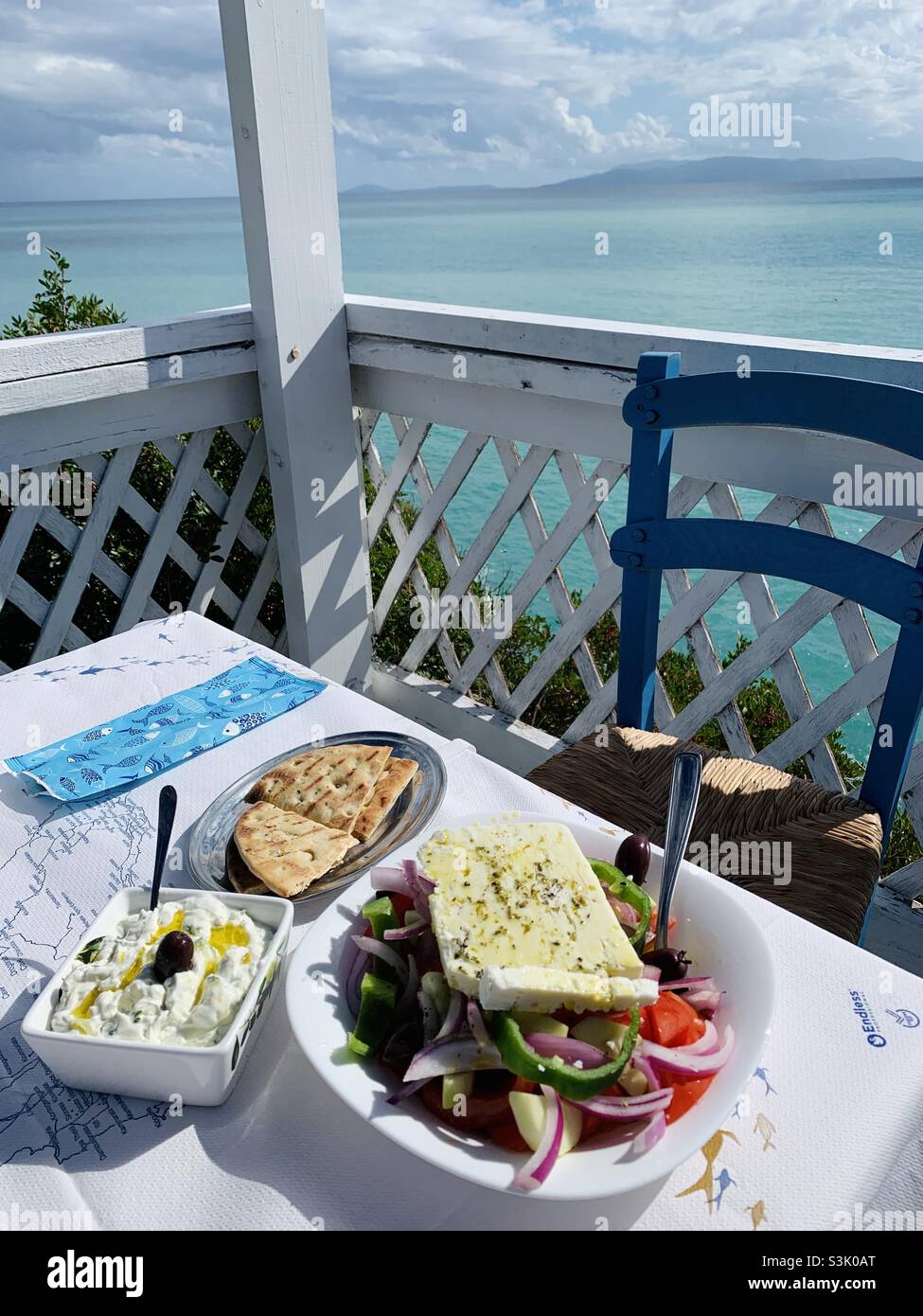 Greek salad tatziki and pitta at a restaurant on the coast in kefalonia - Smartphone Captured Stock Image